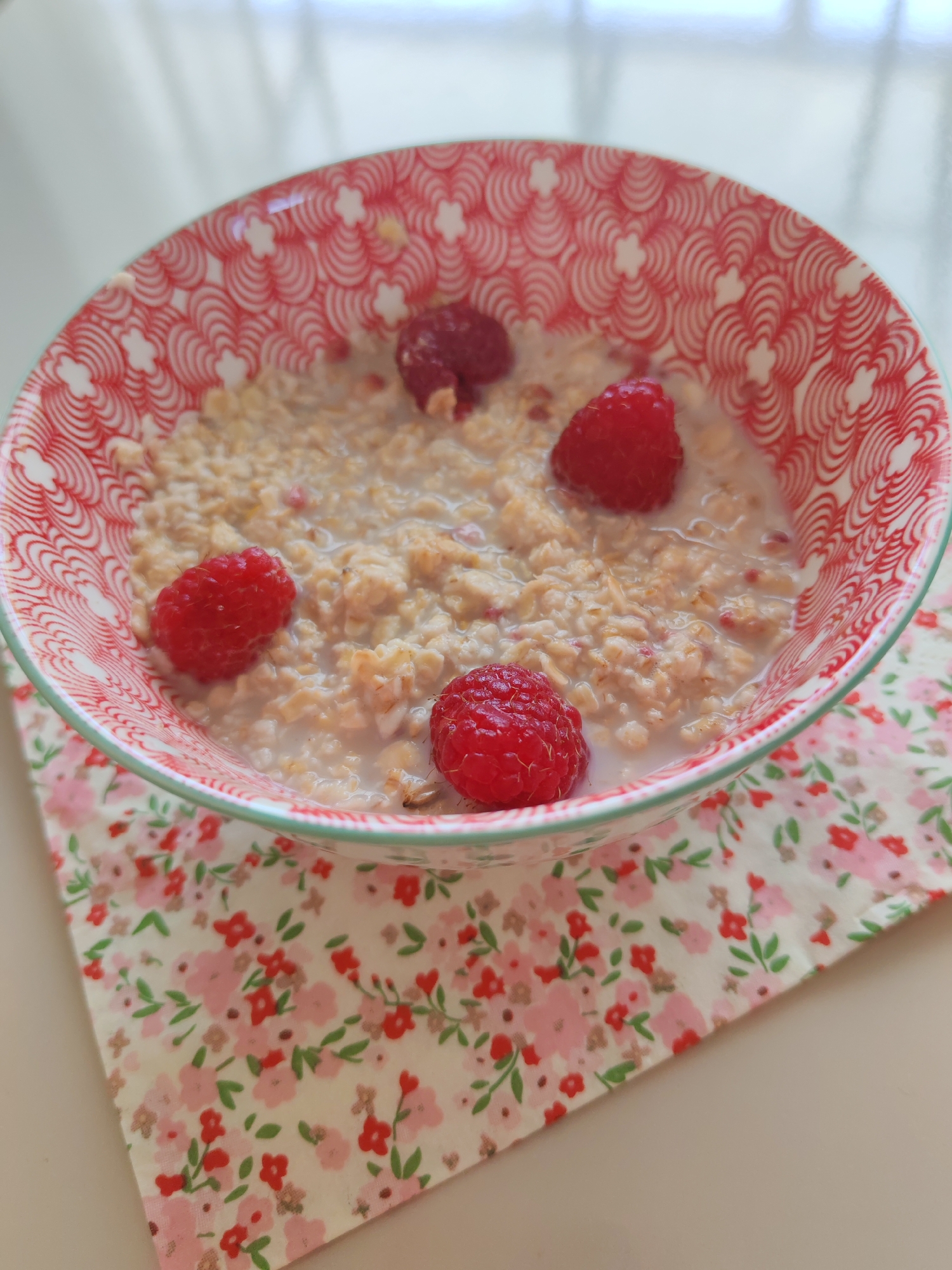 Raspberry breakfasts and a rose, shot close-up in Baku