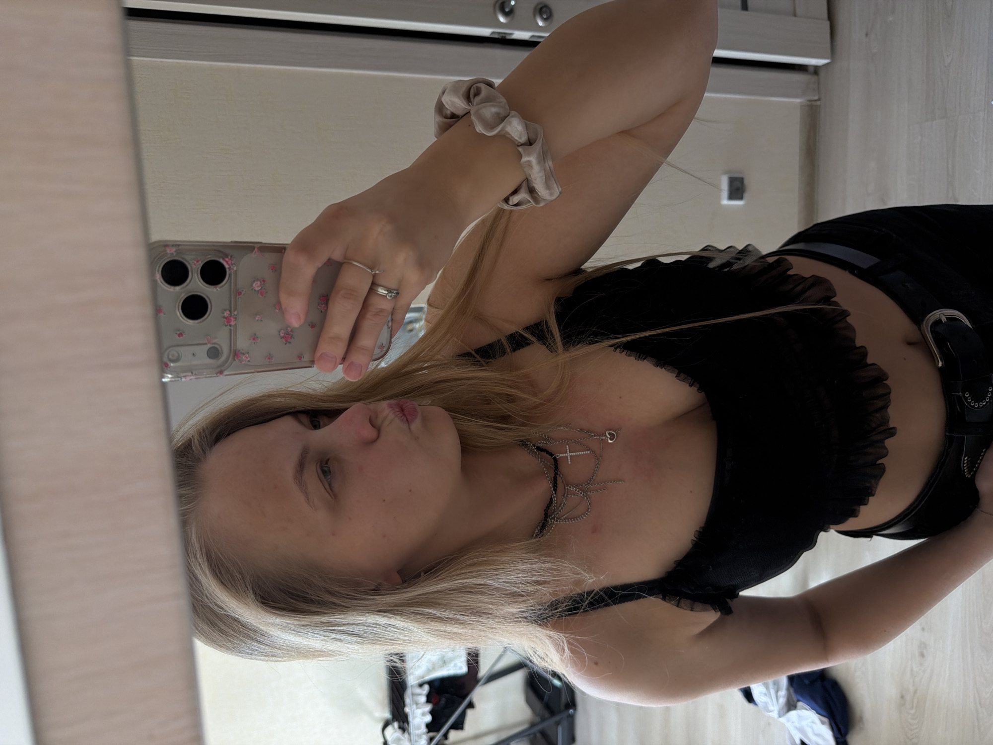Woman takes mirror selfie series in Izhevsk bedroom