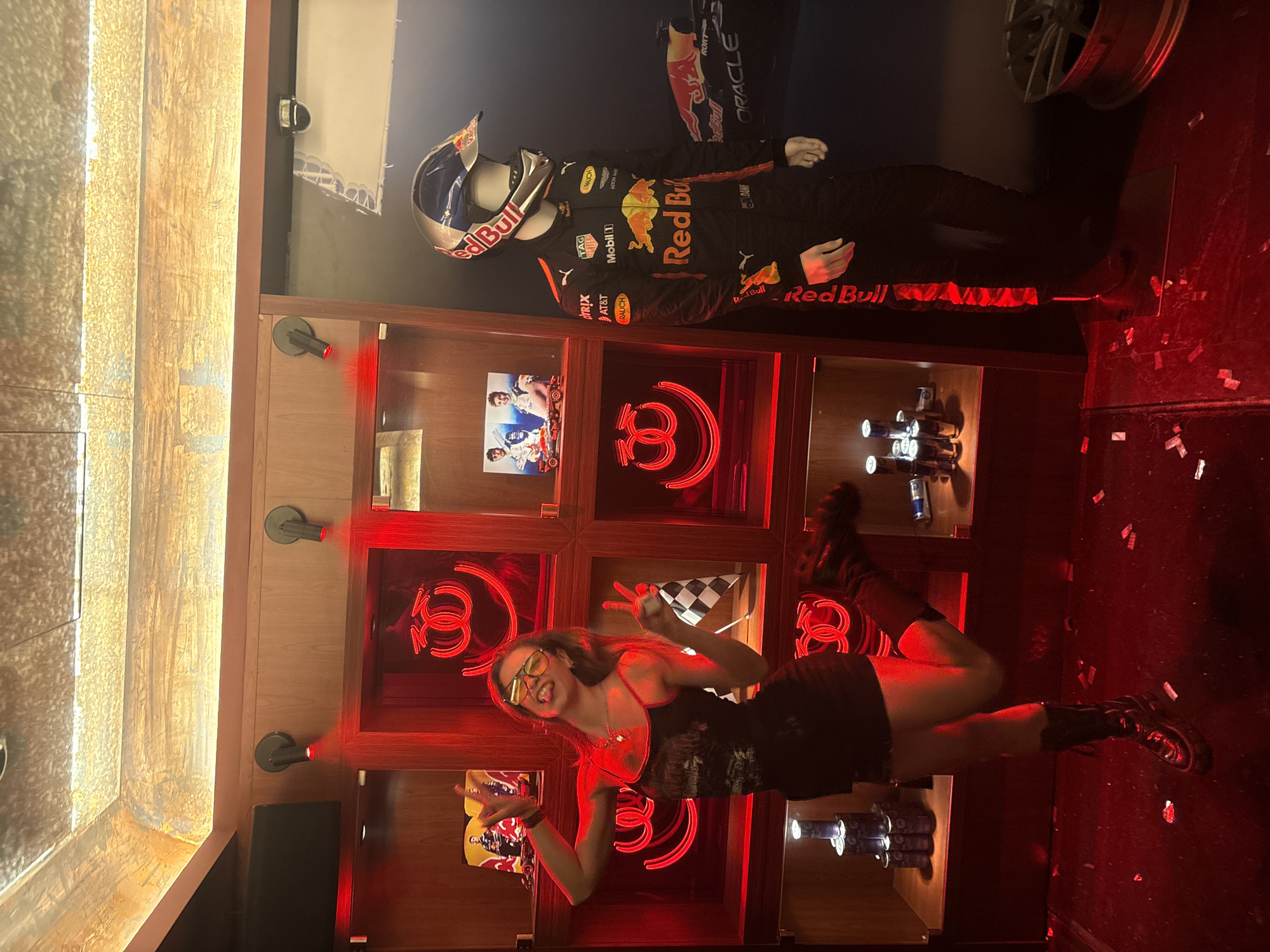 Woman poses at Red Bull Racing display in Hong Kong