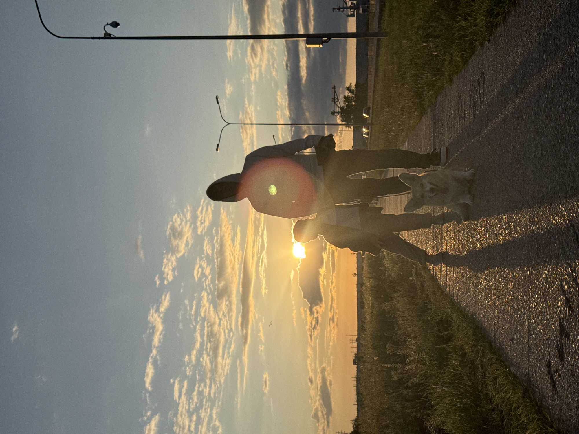 Sunset gathering documented along Kama River waterfront in Chaikovsky