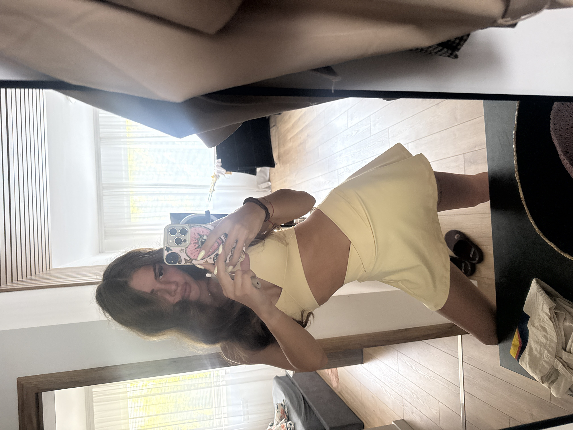 Mirror selfies in a Plovdiv space, light yellow outfit, June 2026