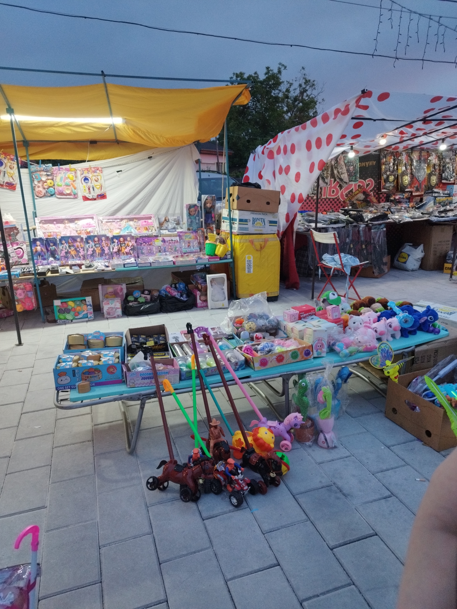 Urban scenes documented: marketplace, public square, vehicles, residential areas