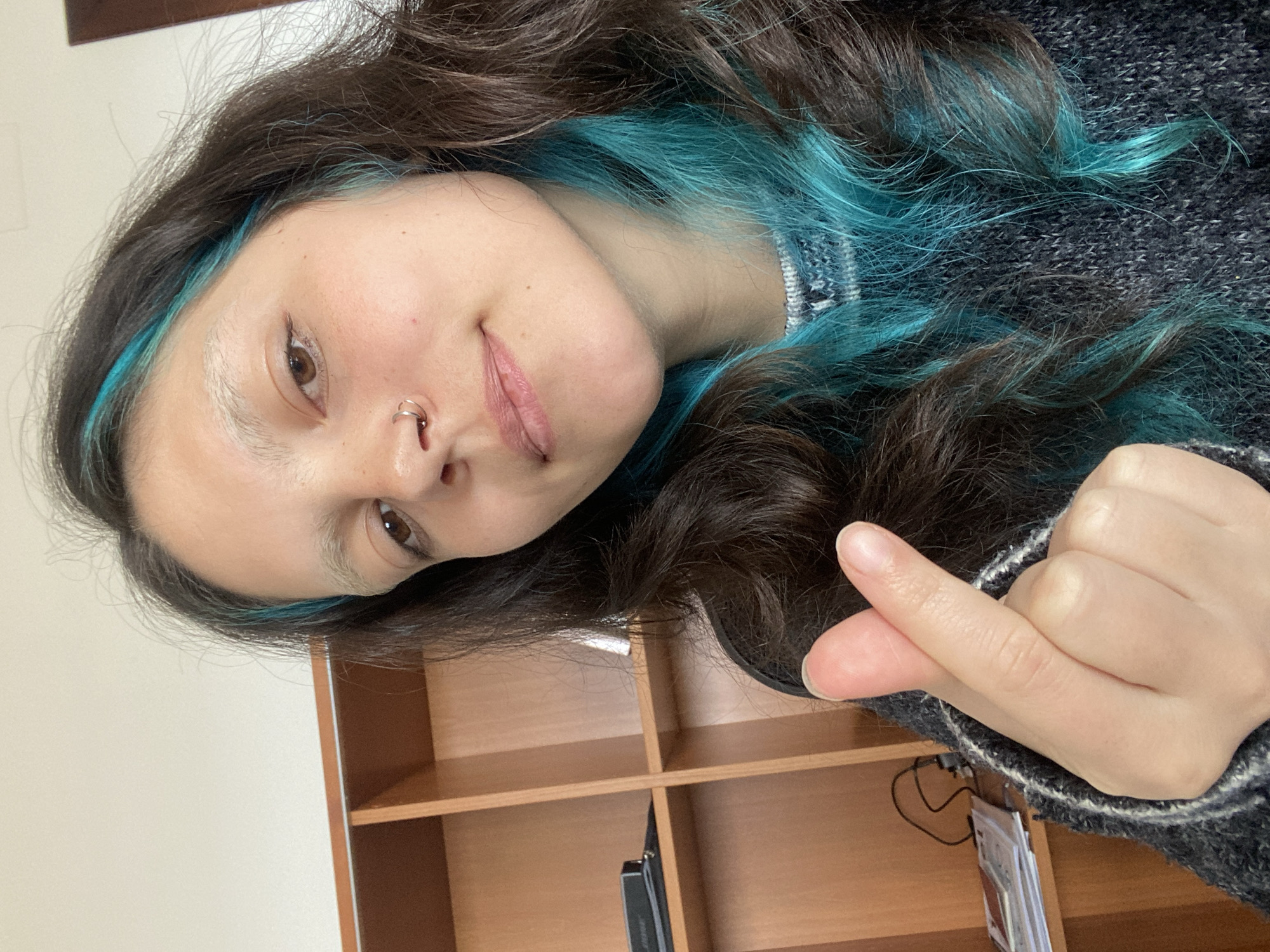Person with turquoise hair highlights photographed in Gijón