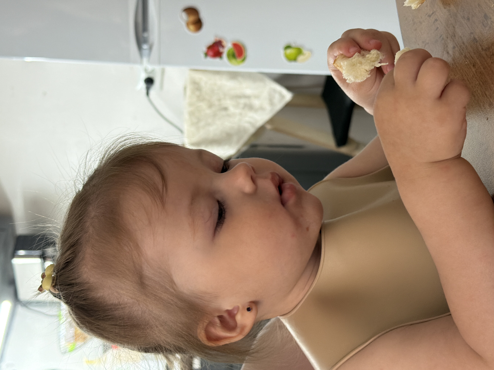Toddler enjoys breakfast in Reshetnikovo, Russia