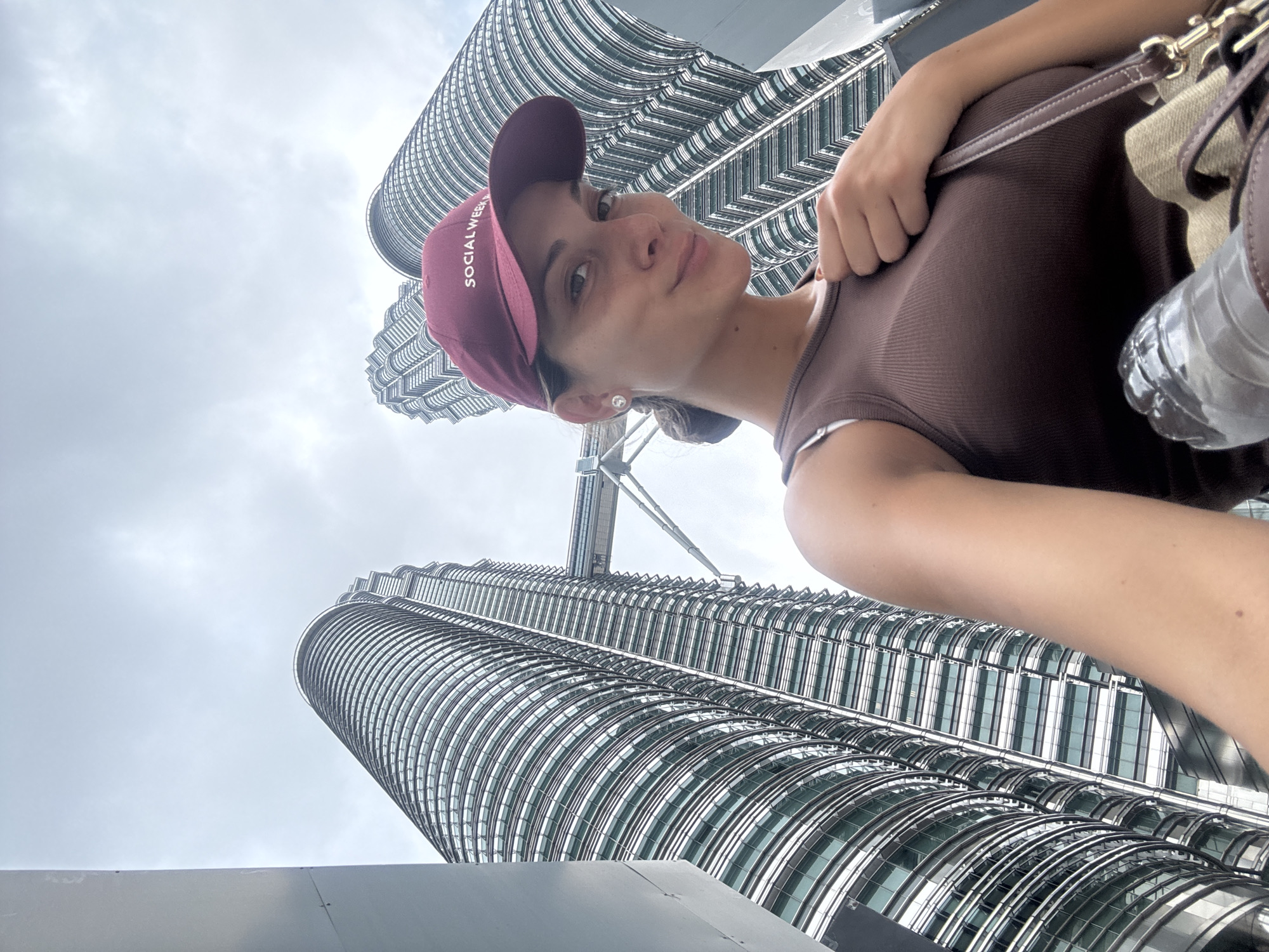 Woman photographed at Petronas Twin Towers in early morning