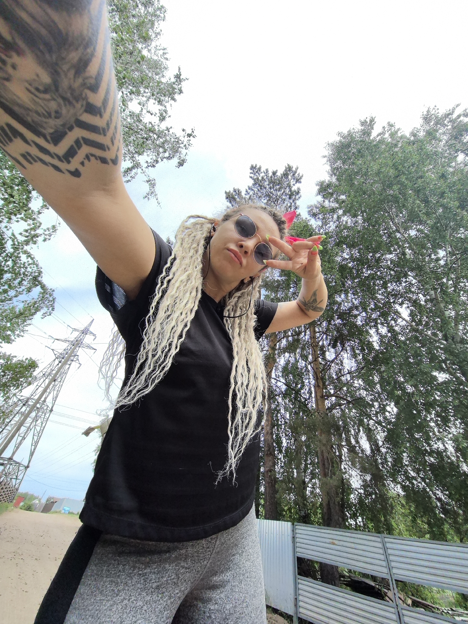 Woman takes selfie outdoors in Noviy, Russia
