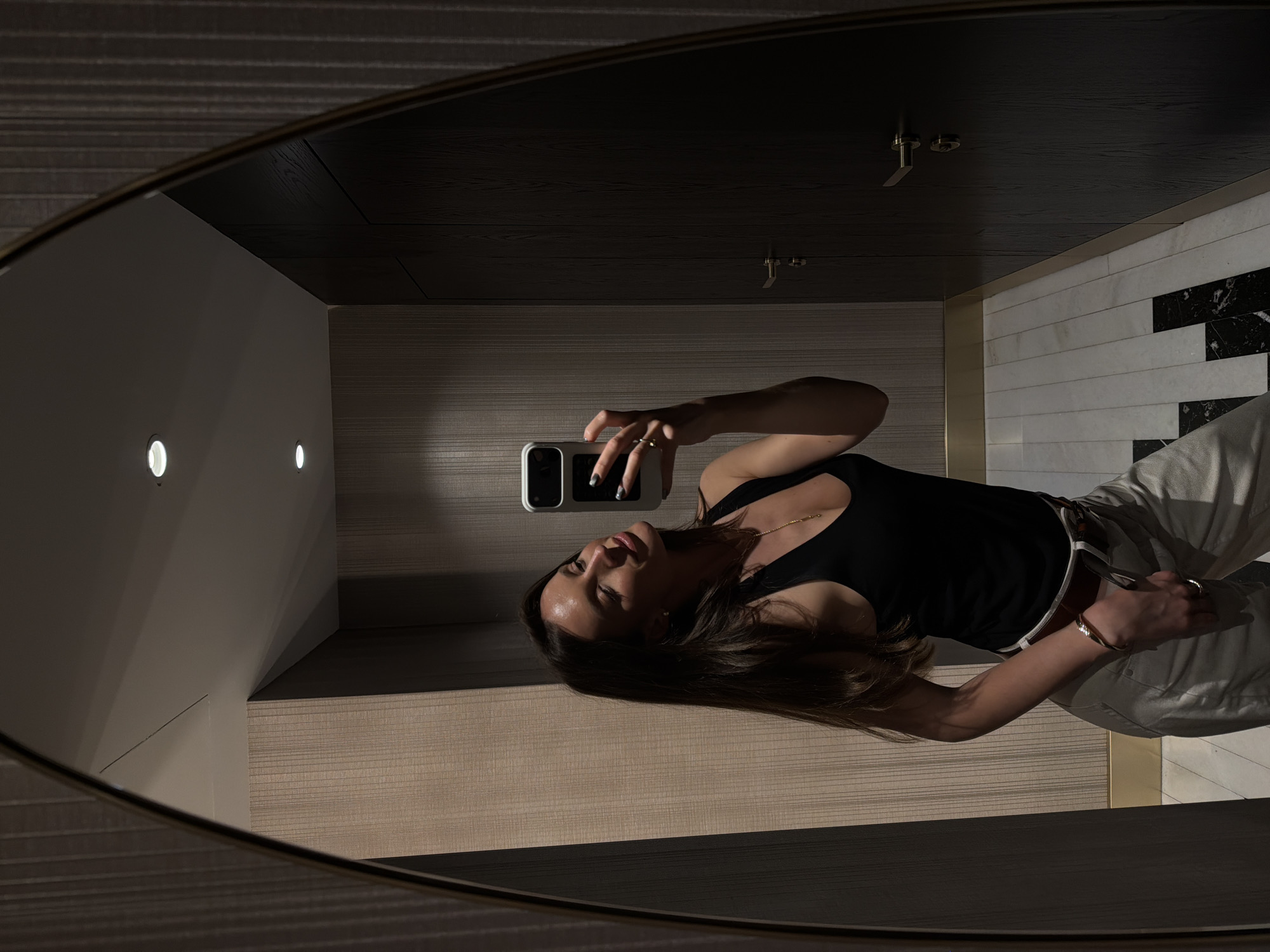Woman Takes Mirror Selfie in Modern Bathroom in Budva