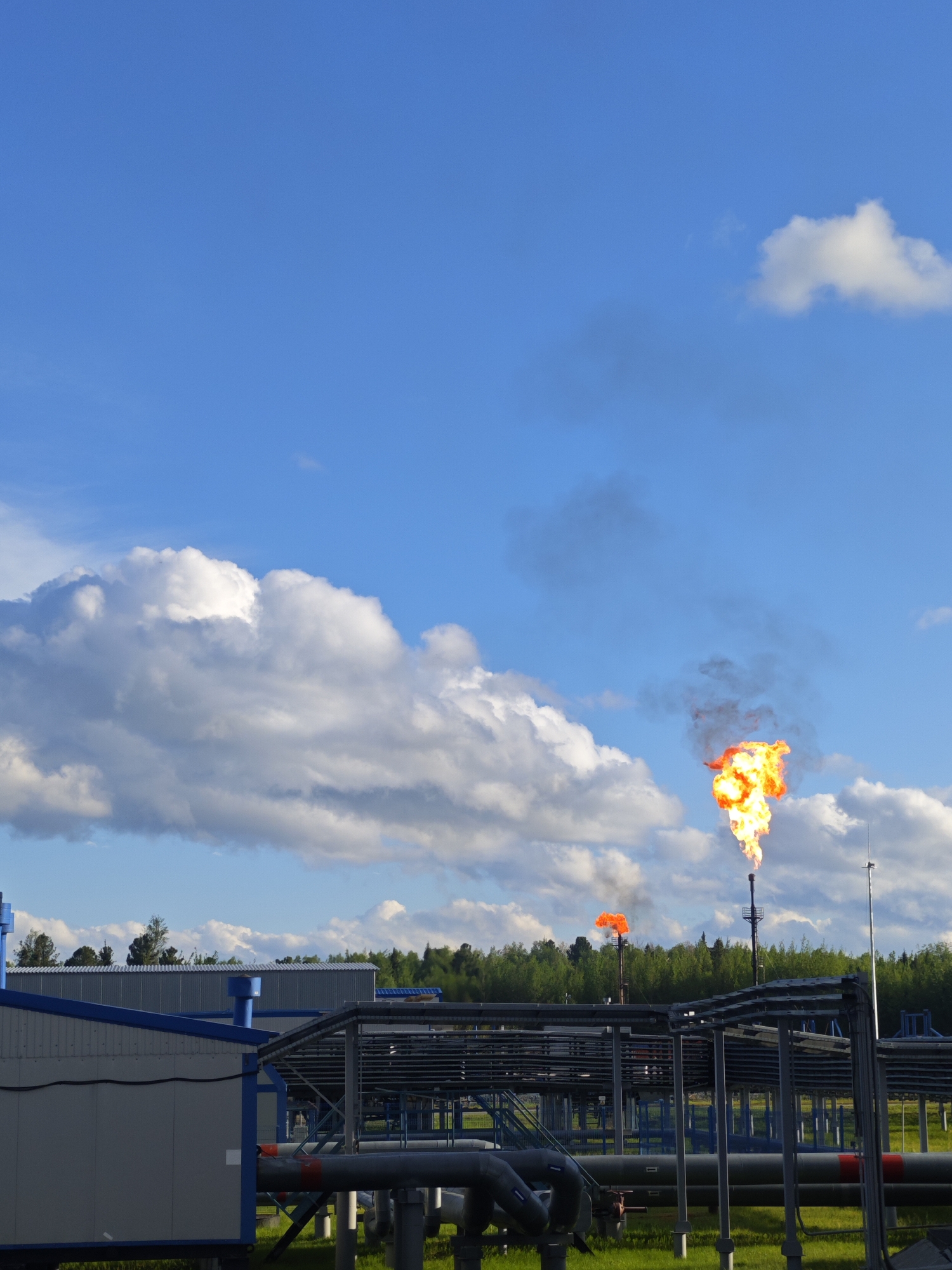 Industrial plant operator monitors facility systems from control room