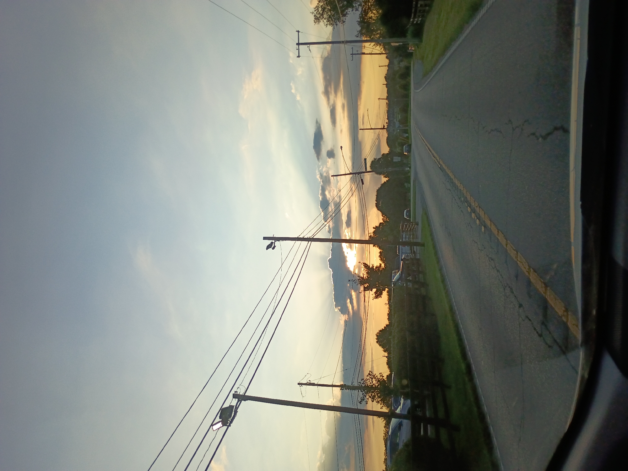 Driving a quiet Kentucky road at golden hour