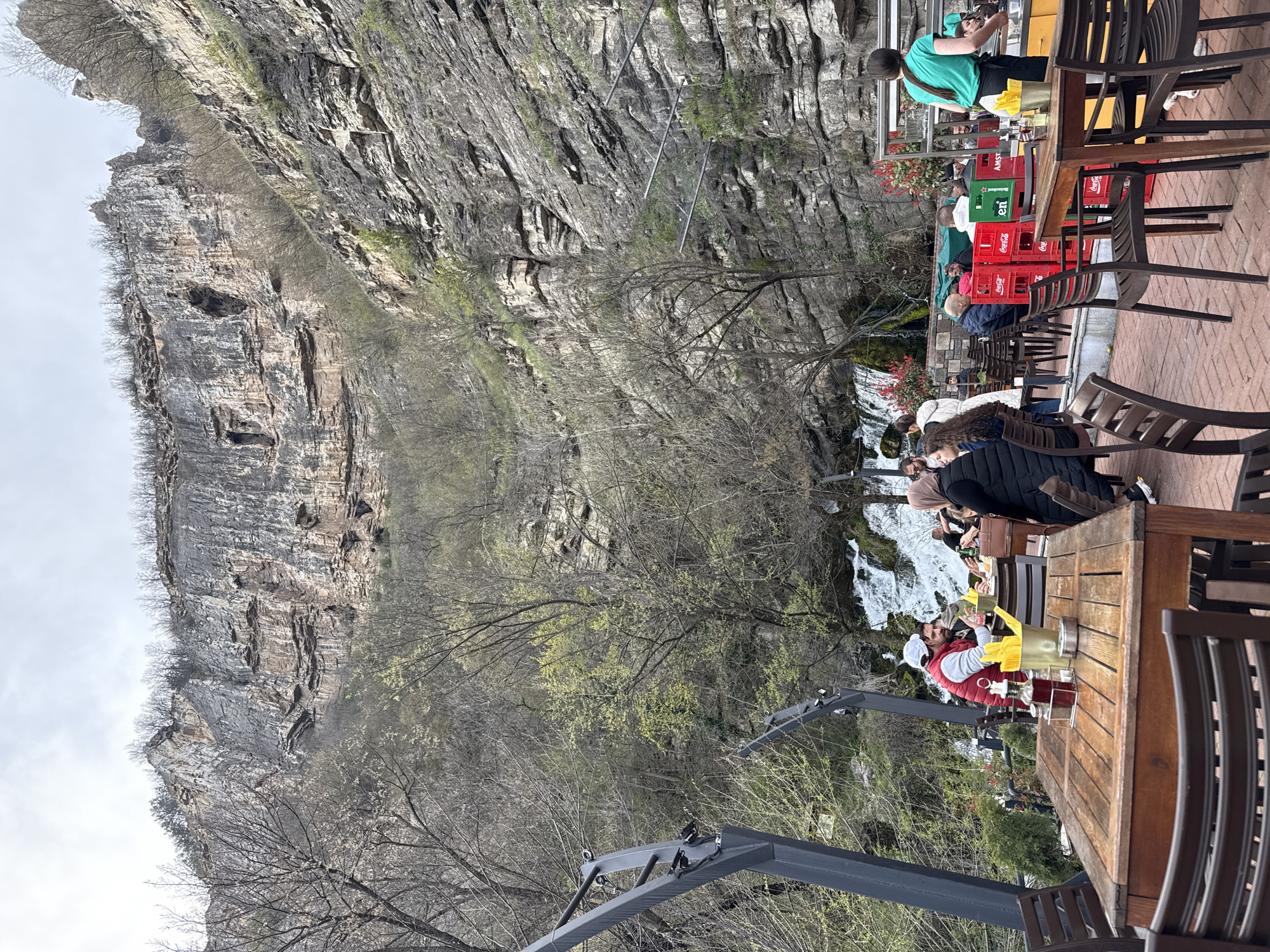 Diners gather at cliffside waterfall restaurant in Milanovo, Bulgaria
