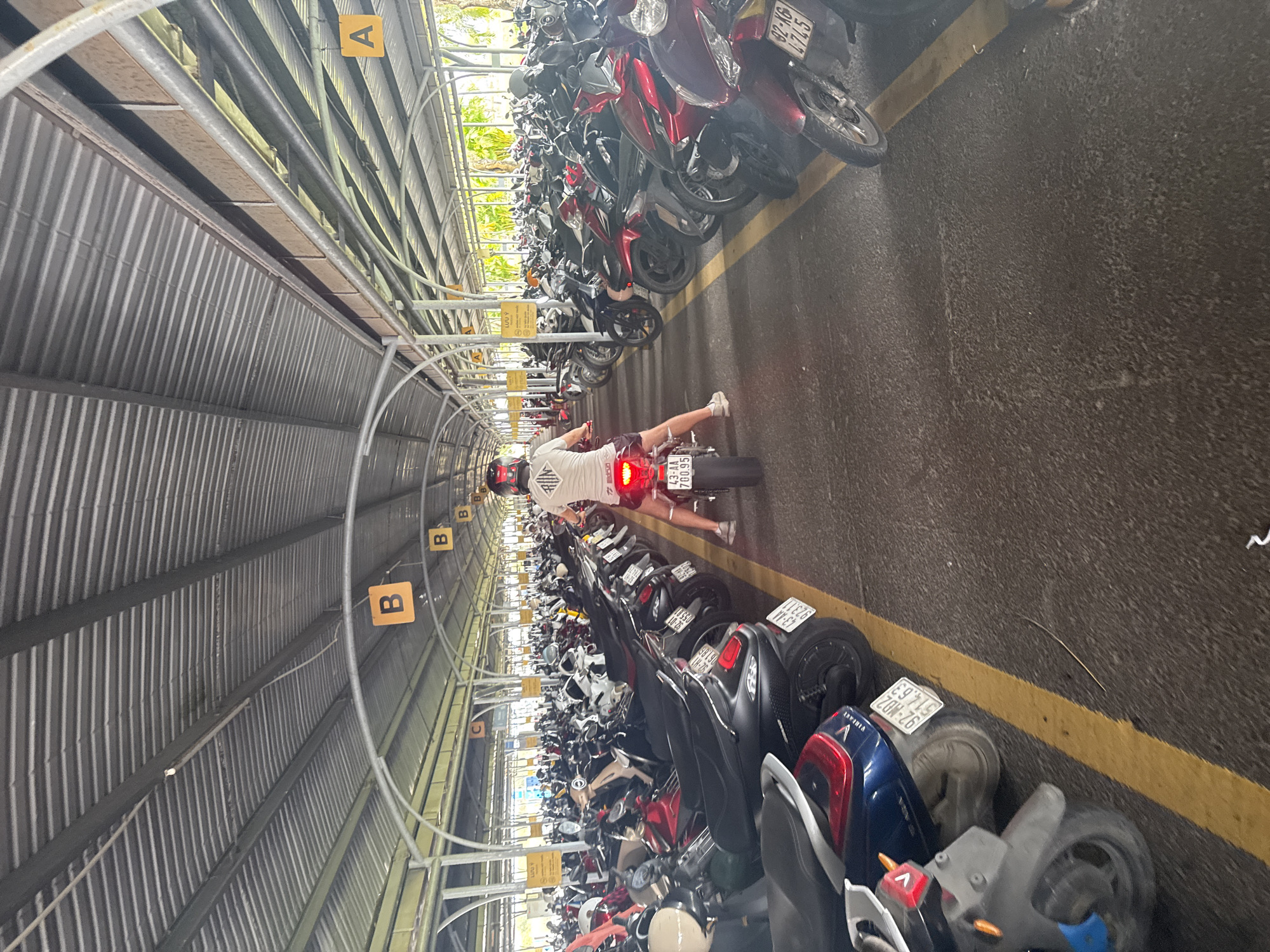 Covered motorcycle parking facility observed in Đà Nẵng, Vietnam
