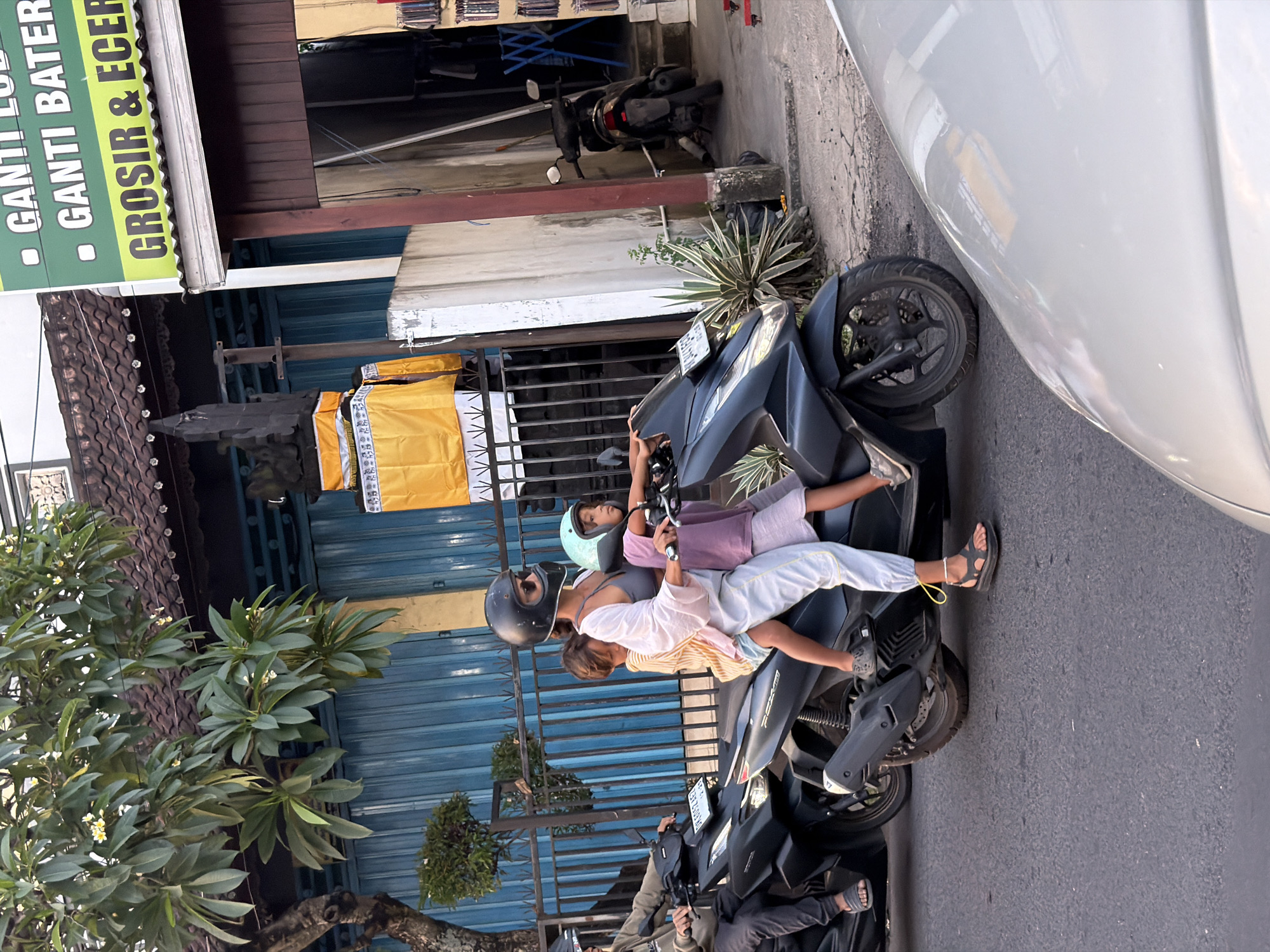 Ceremonial effigy procession moves through busy North Kuta streets