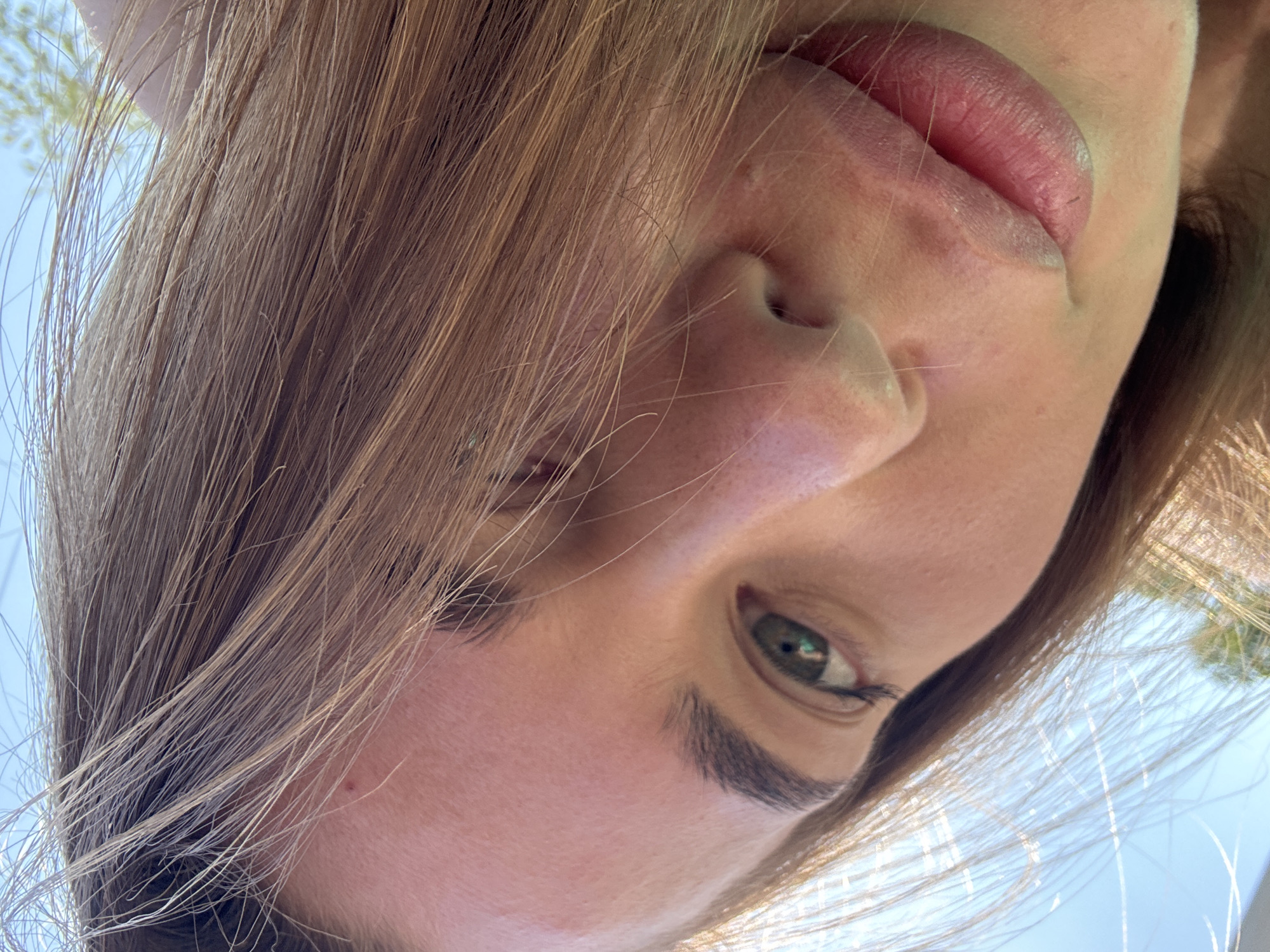 Woman takes selfies outdoors in Sosnovy, Russia