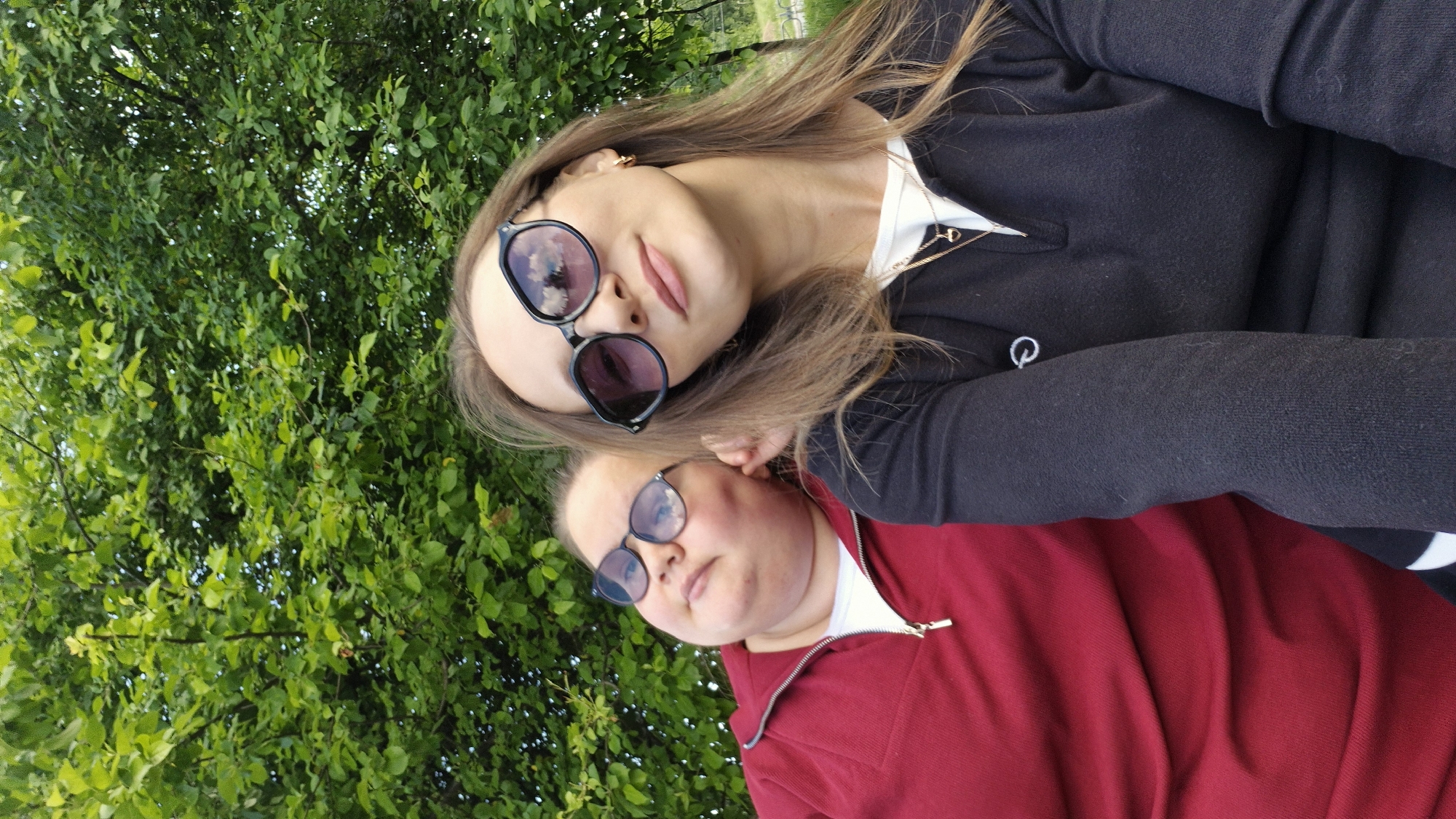 Women take selfies during afternoon outing in Chaikovsky park