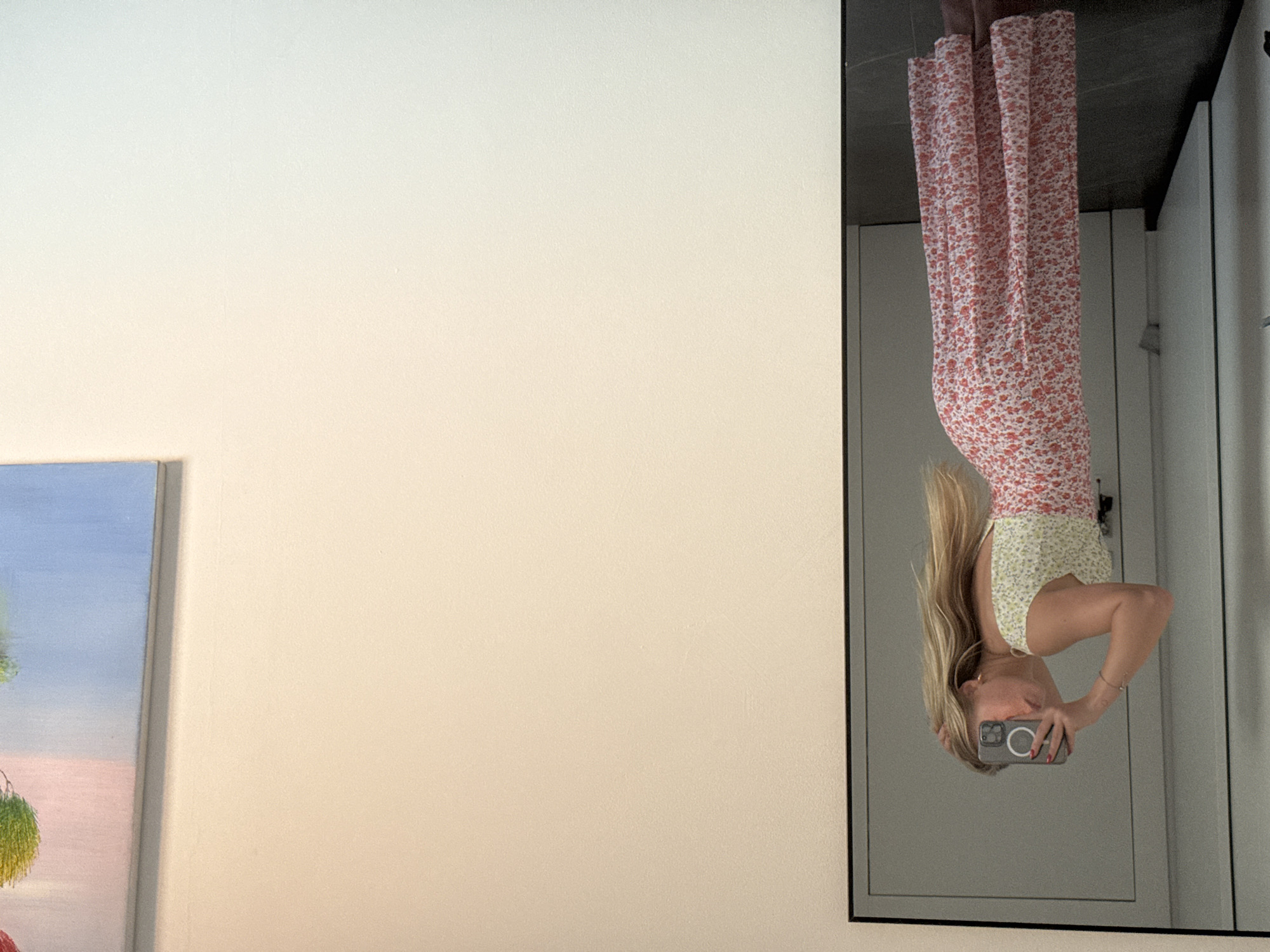 Woman takes upside-down mirror selfie in Ariel