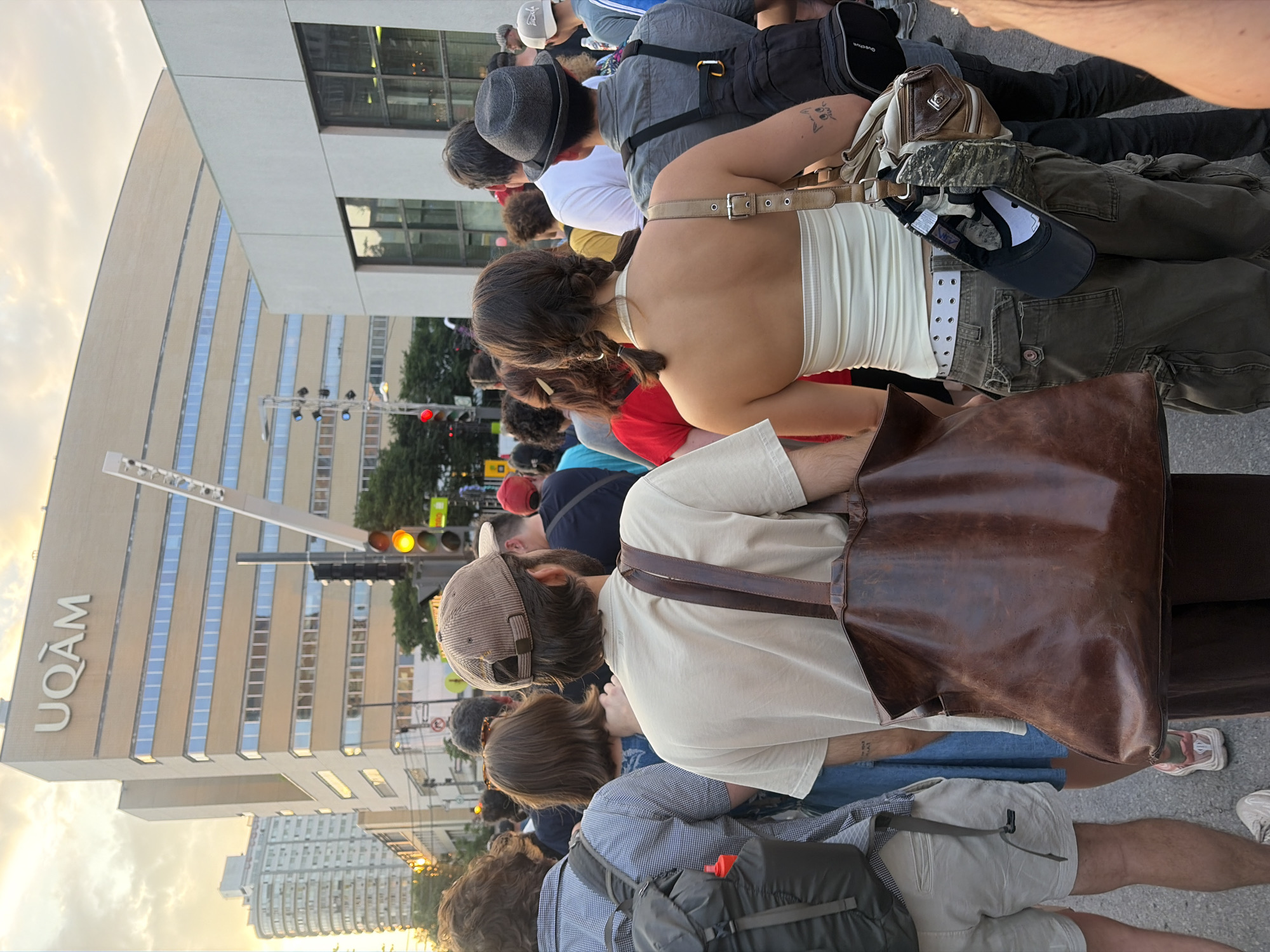 Crowd gathers on the street outside UQAM in Montreal