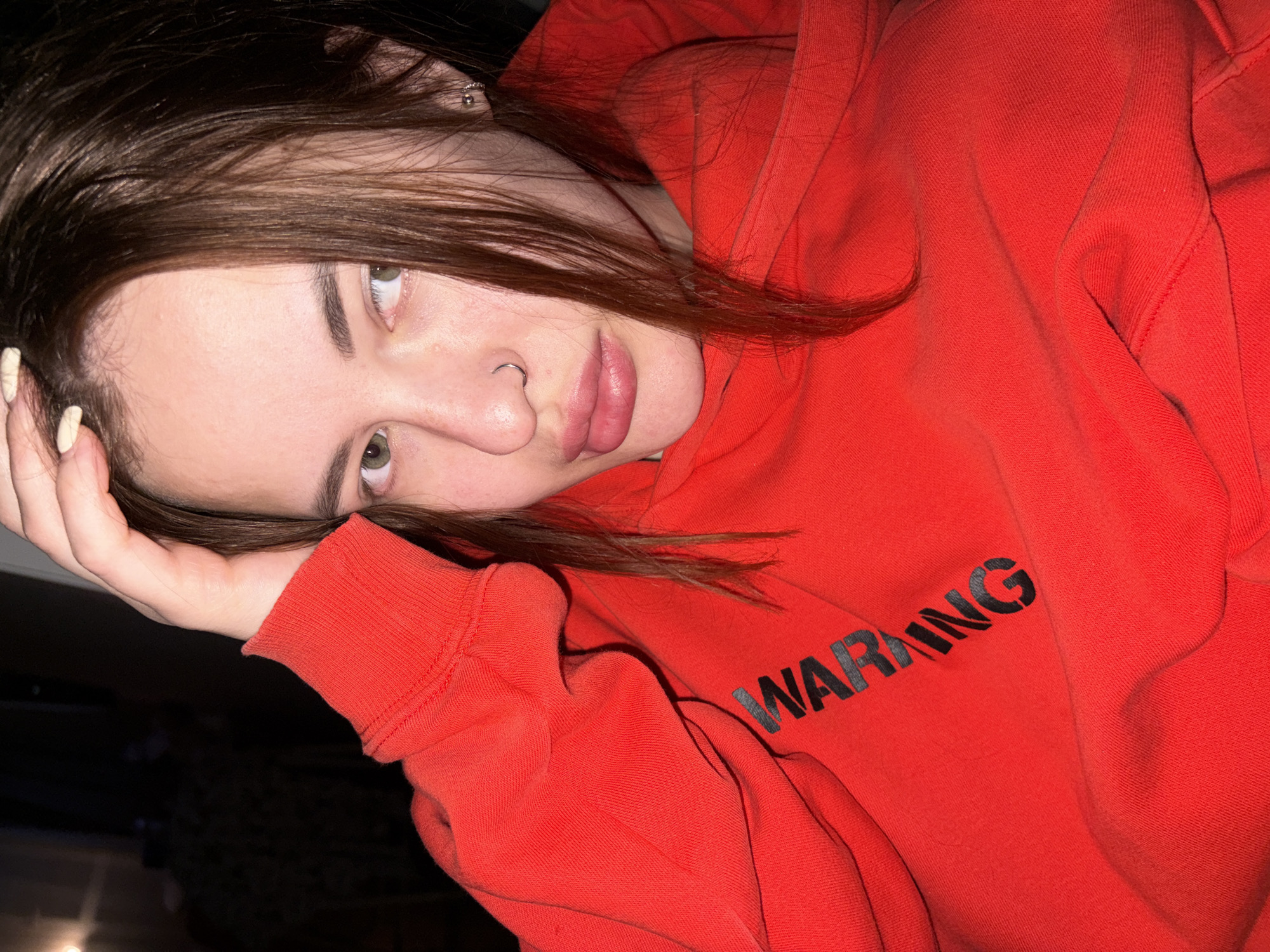 Person in Warning Hoodie Spotted in Contemplative Pose, Russia