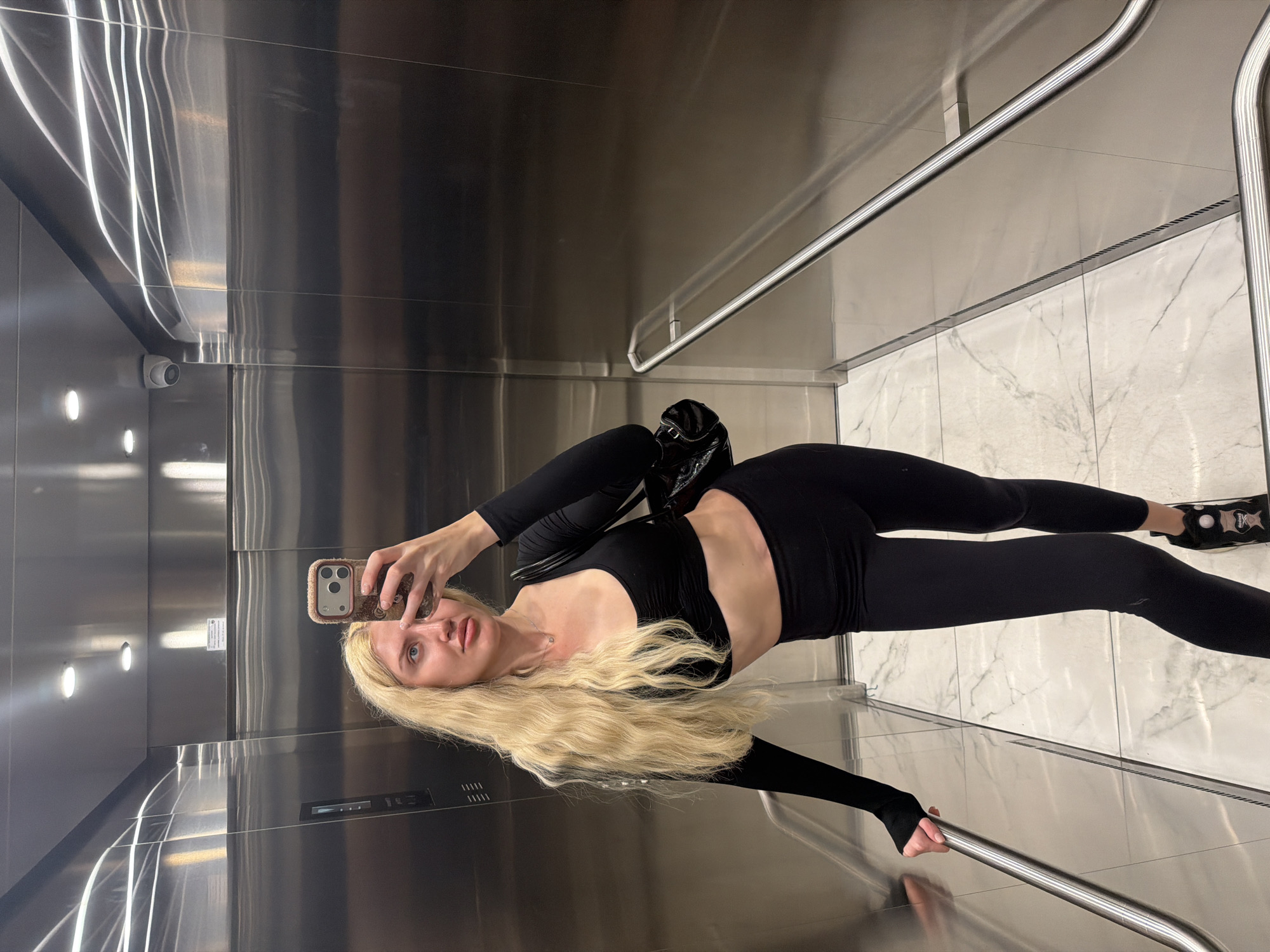 Belgrade moments: elevator selfie and cat among roses