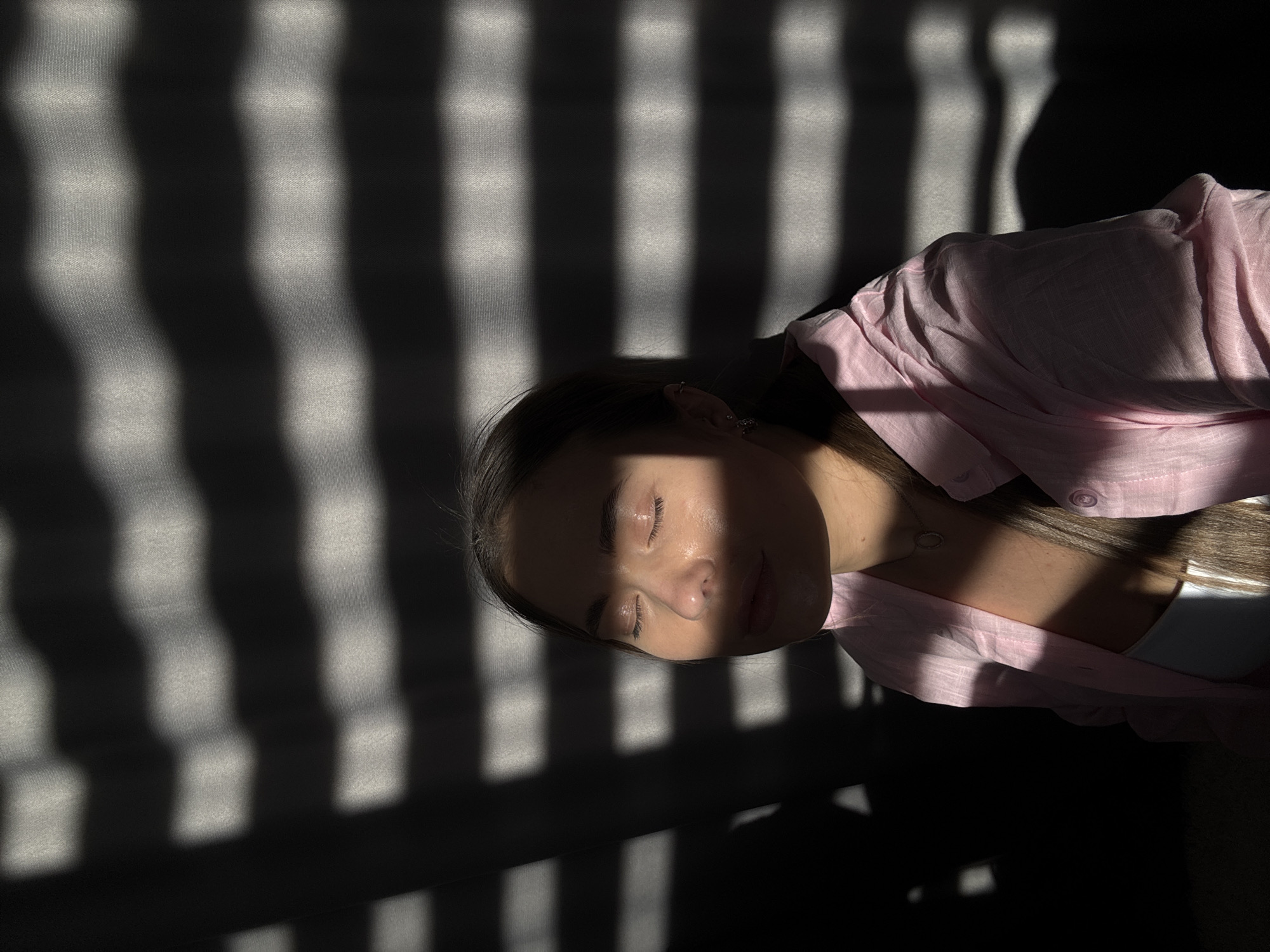 Woman photographed in dramatic sunlight patterns, Chernushka, Russia