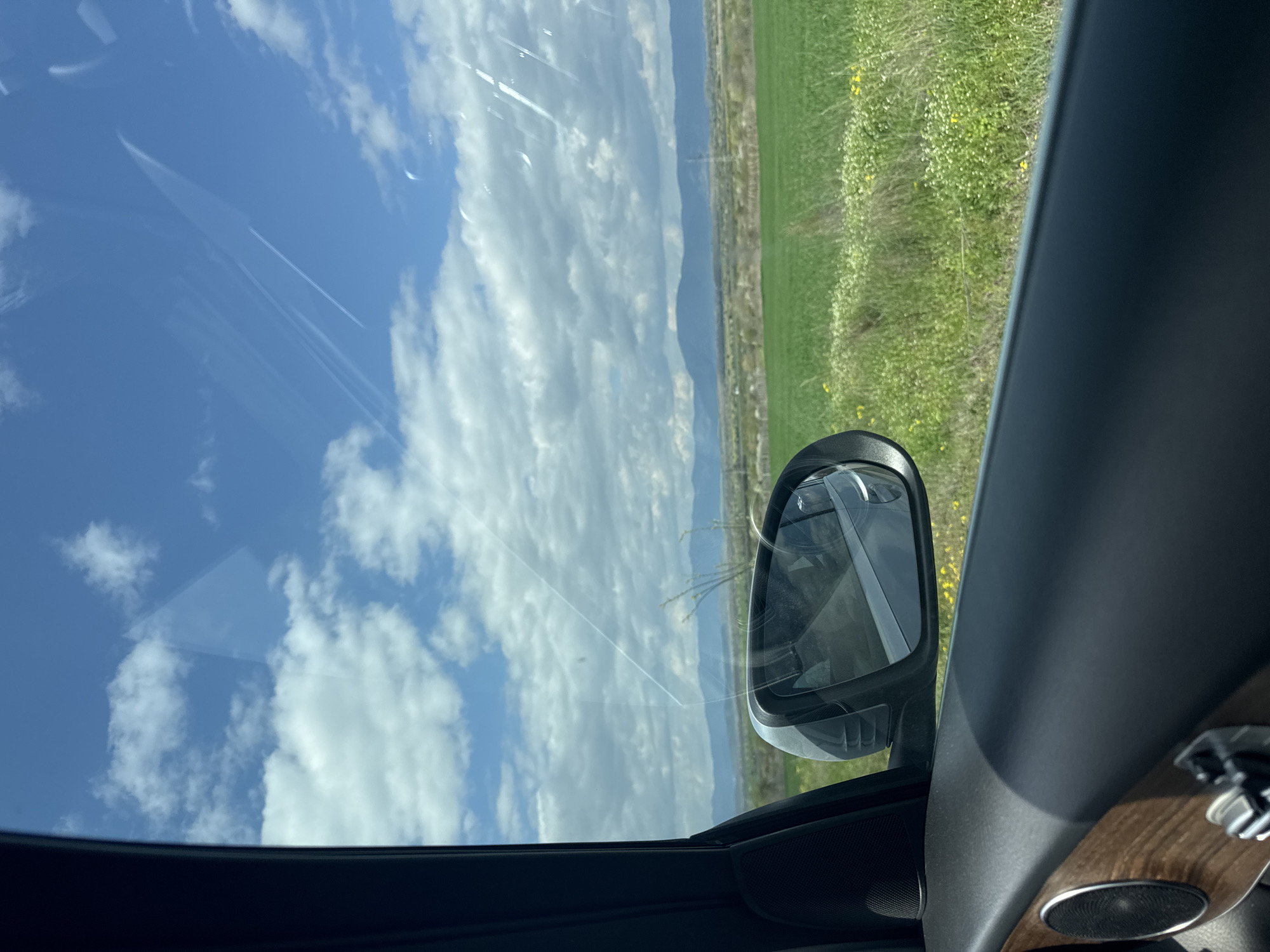 Driver documents rural Bulgarian countryside view from vehicle