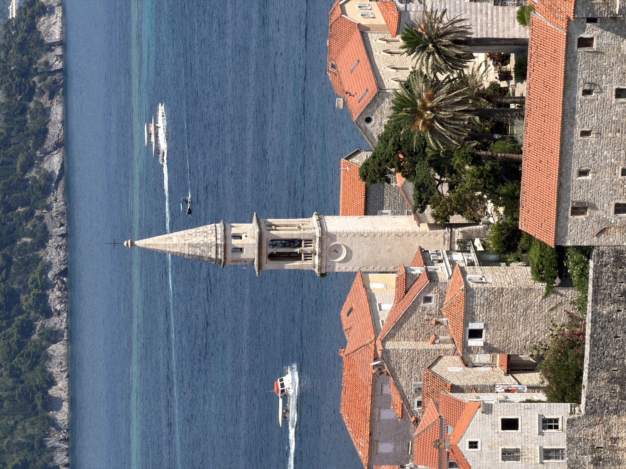Aerial tour of Budva's Old Town, coastline, and harbor