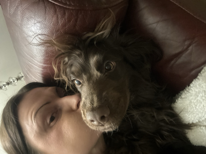 Woman and dog share quiet evening moments in Wealden home