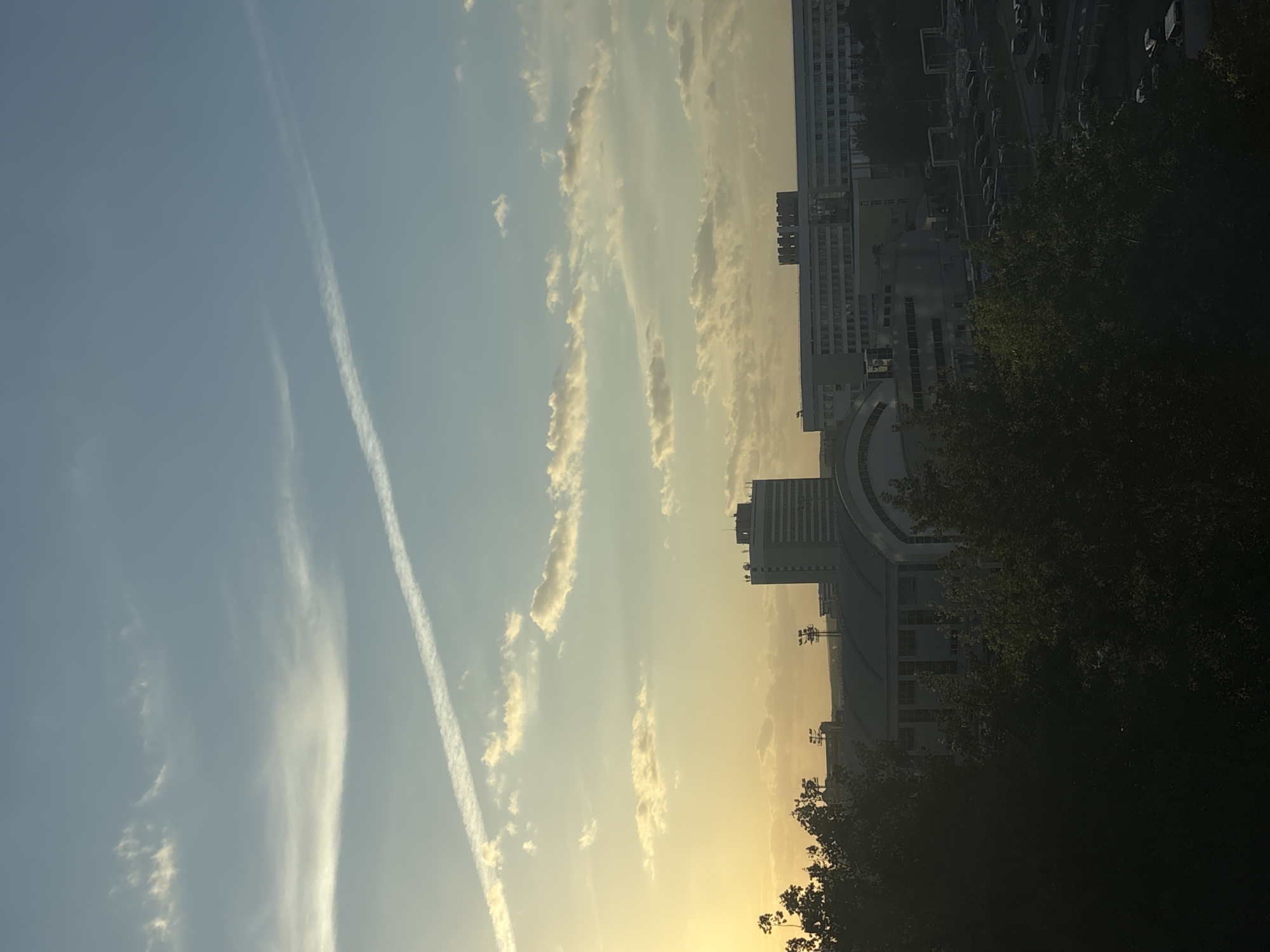Minsk resident documents personal items and cityscape during evening