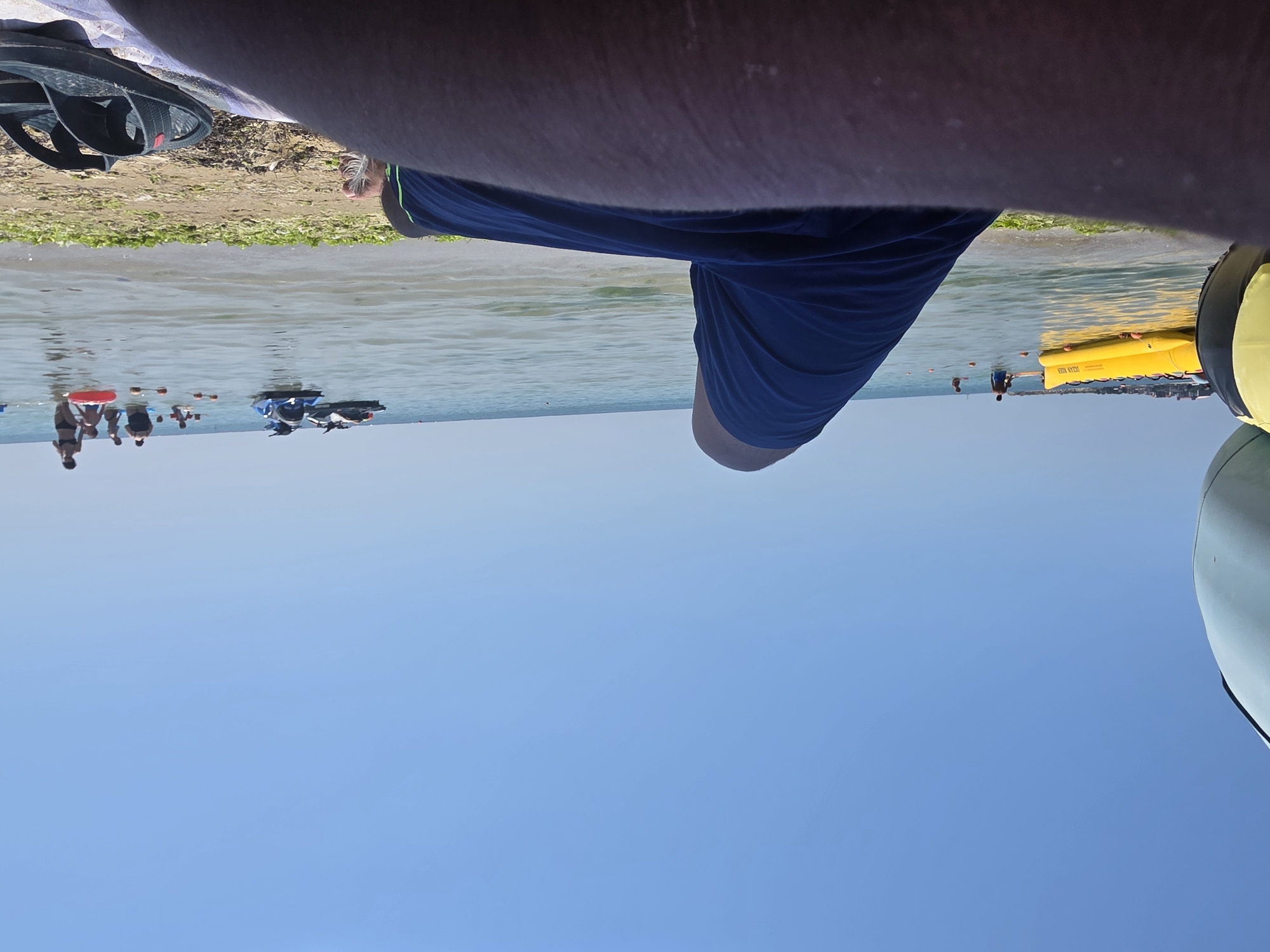 Lazy beach day: sun, jet skis, and a thatched-roof hangout