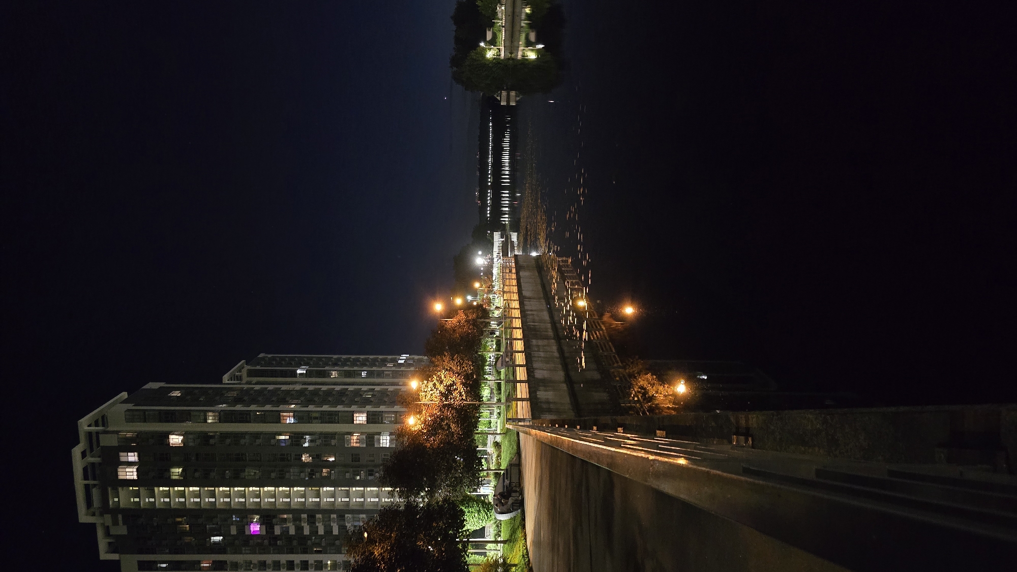 Kyiv's illuminated Dnipro embankment captured from multiple nighttime angles