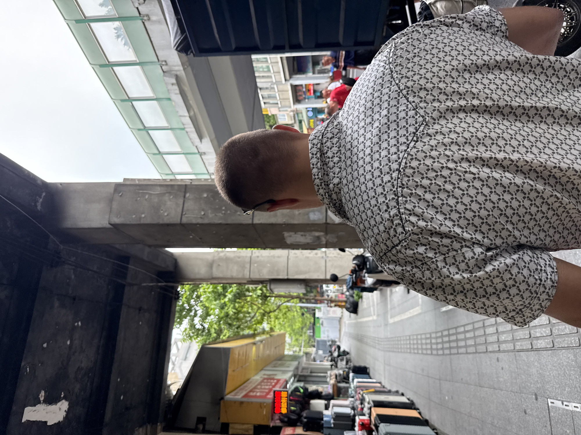 Street-level morning activity under Yuexiu District's elevated overpass
