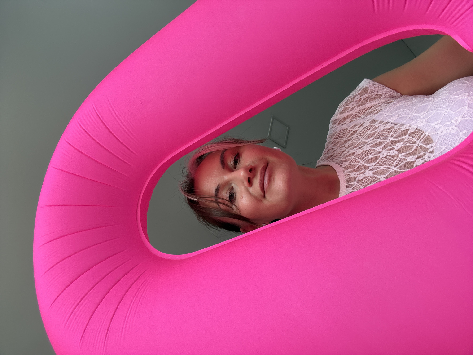 Woman photographed with pink inflatable object in Chaikovsky, Russia