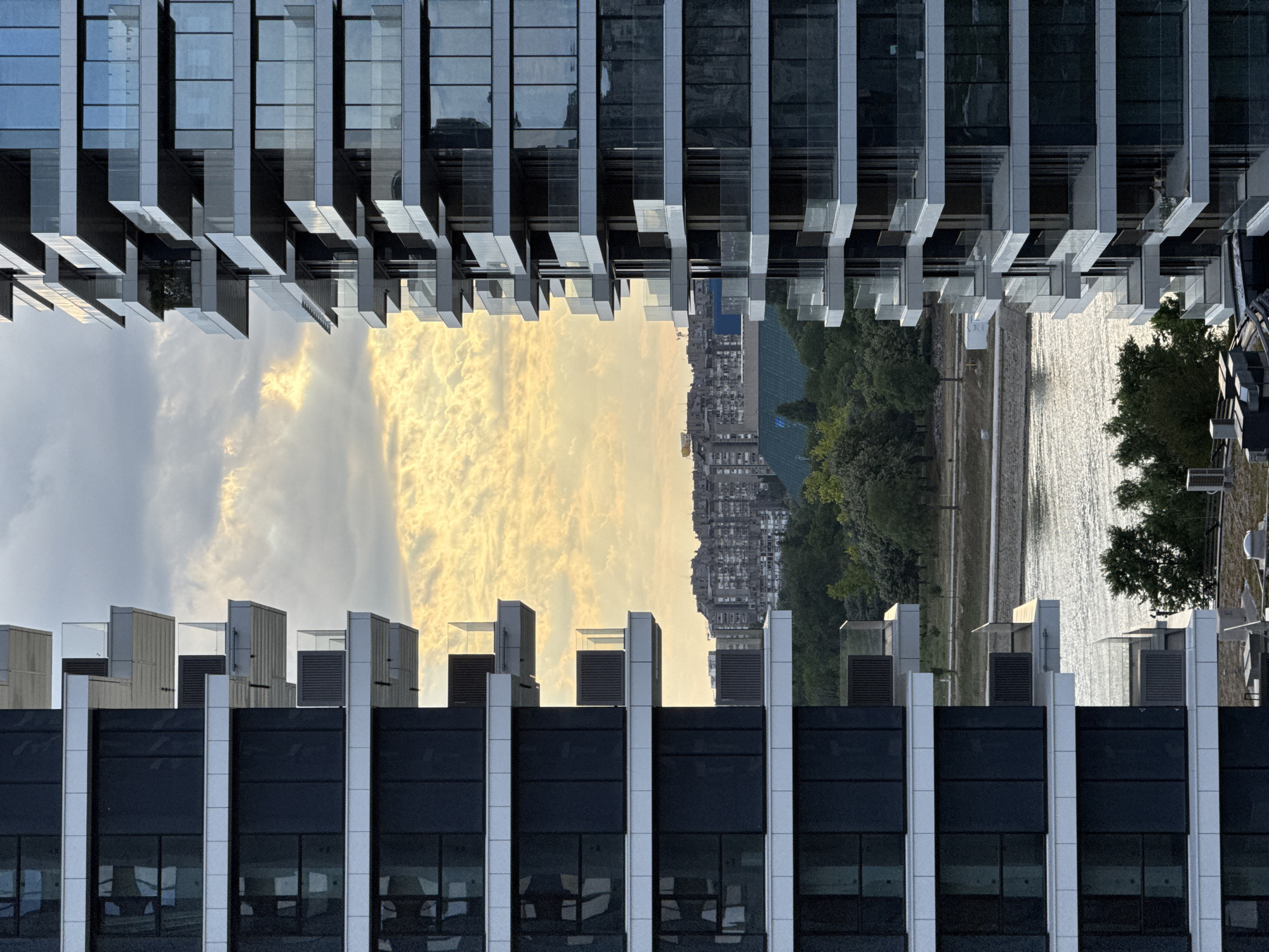 Modern Belgrade skyline under dramatic evening clouds