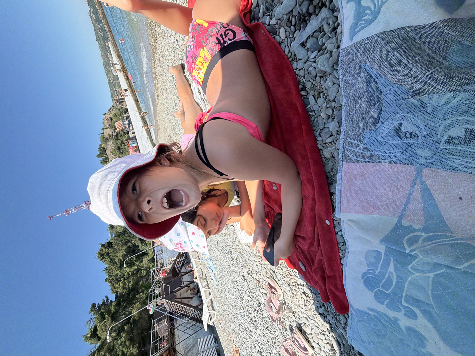 Lazy beach morning on the pebbles in Partenit