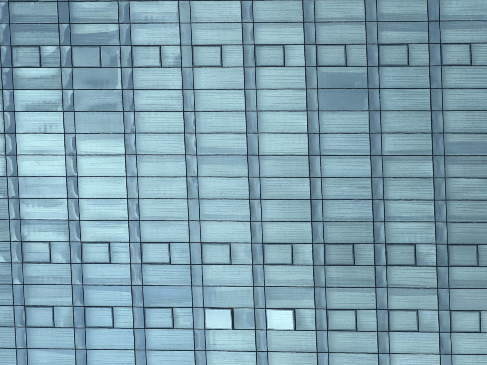 Building facade with grid-pattern windows documented in Tbilisi