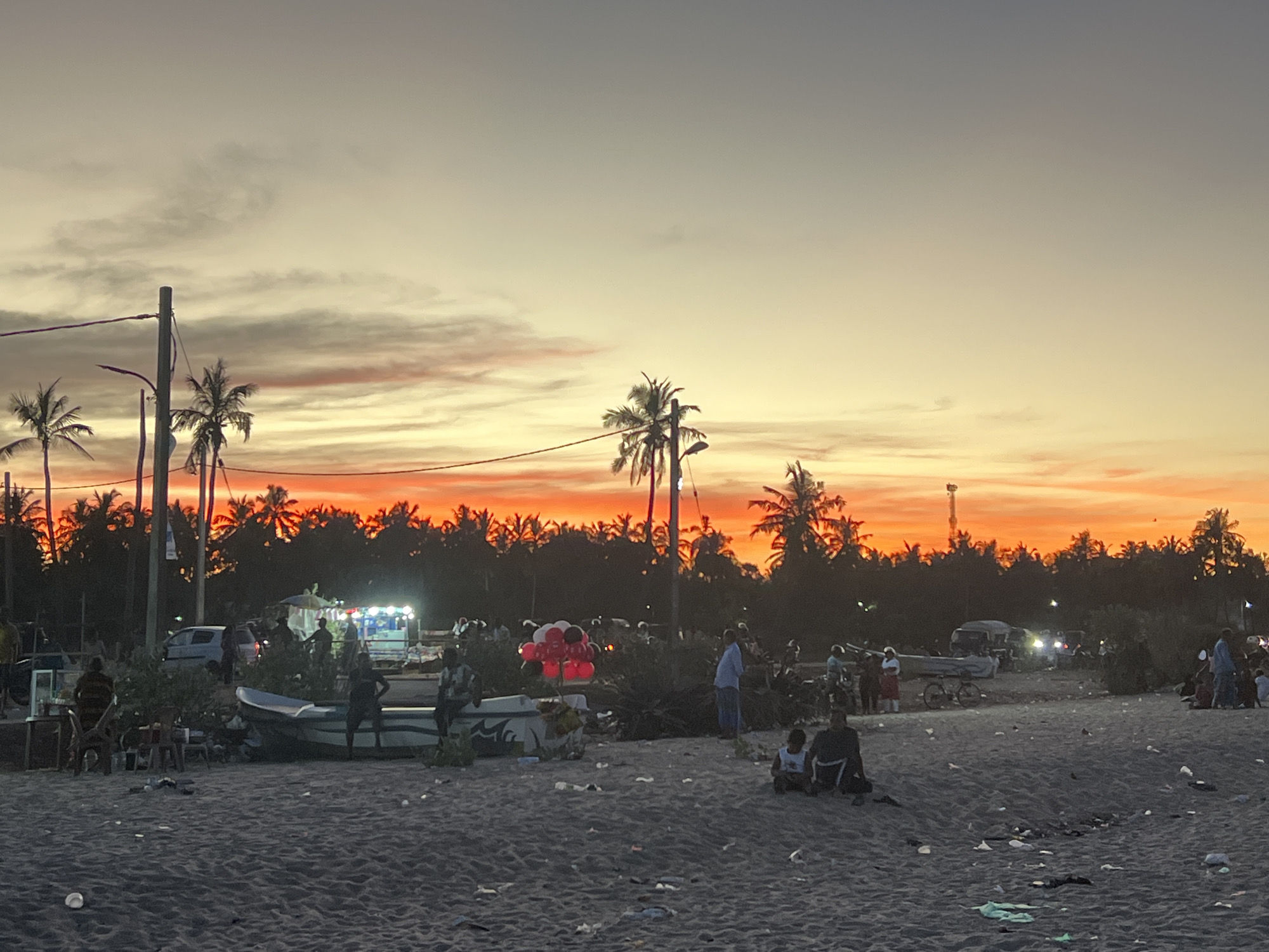 Sunset observed by beachgoers in Kalmunai, Sri Lanka