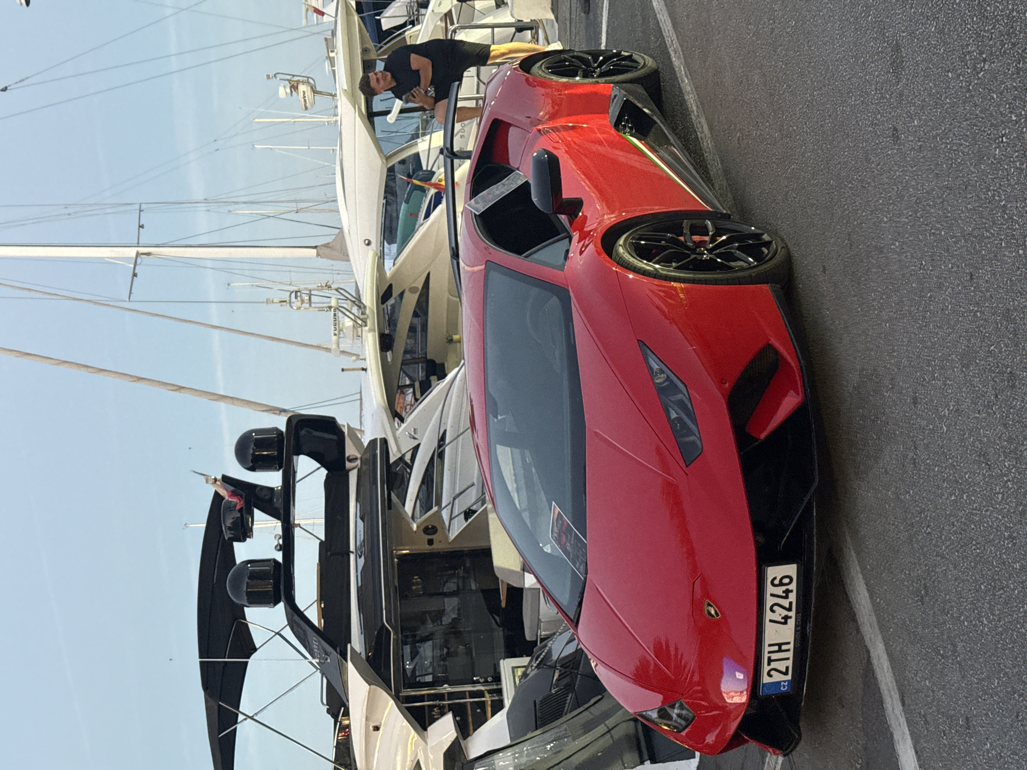 Red Lamborghini, yachts, and evening streets in Puerto Banús