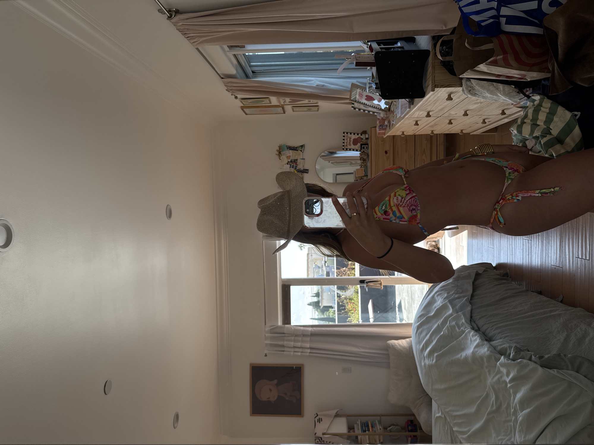 Woman Takes Mirror Selfie in Bikini and Cowboy Hat