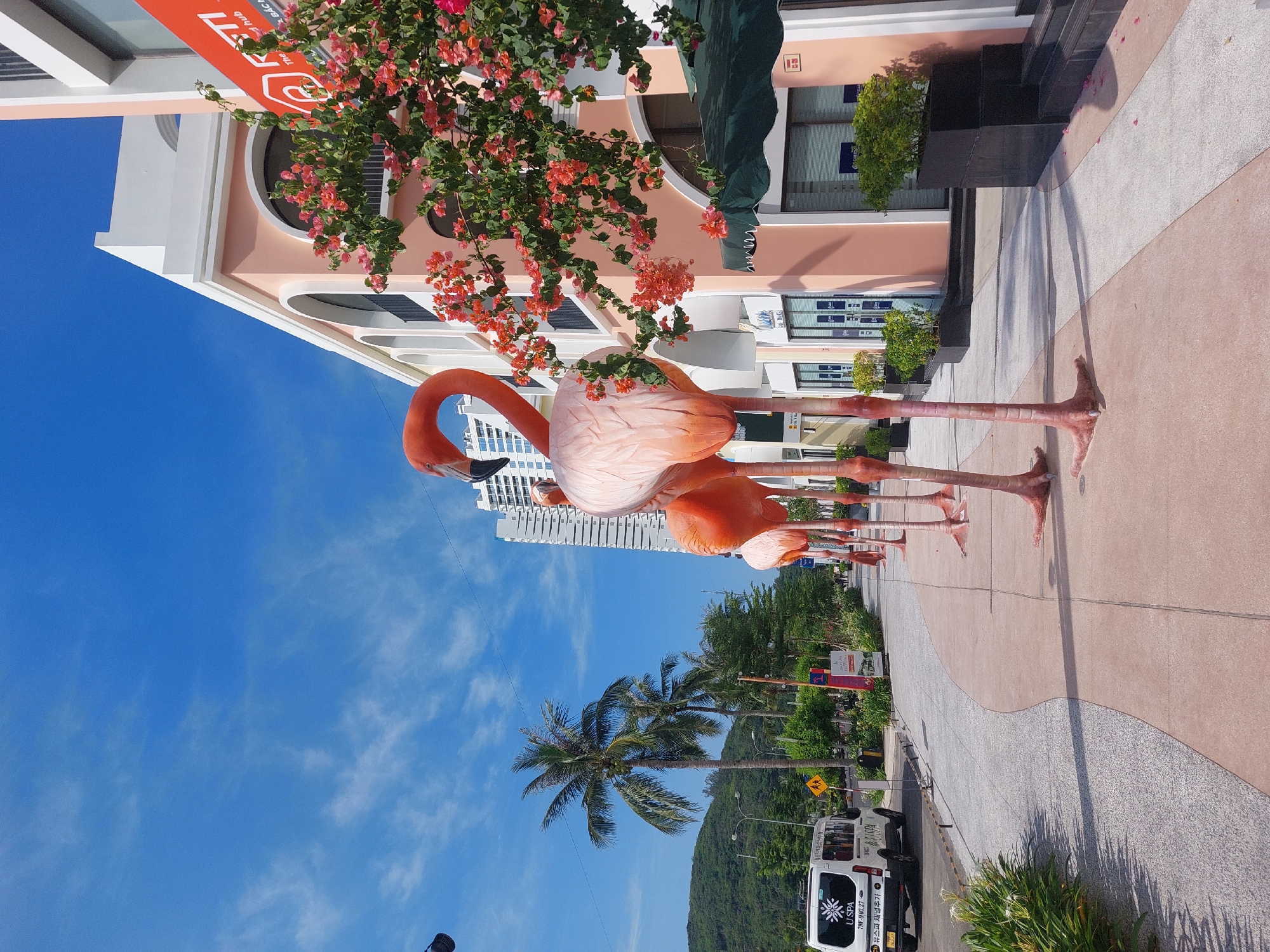 Nha Trang resort complex with sculptures, modern towers, tropical landscaping