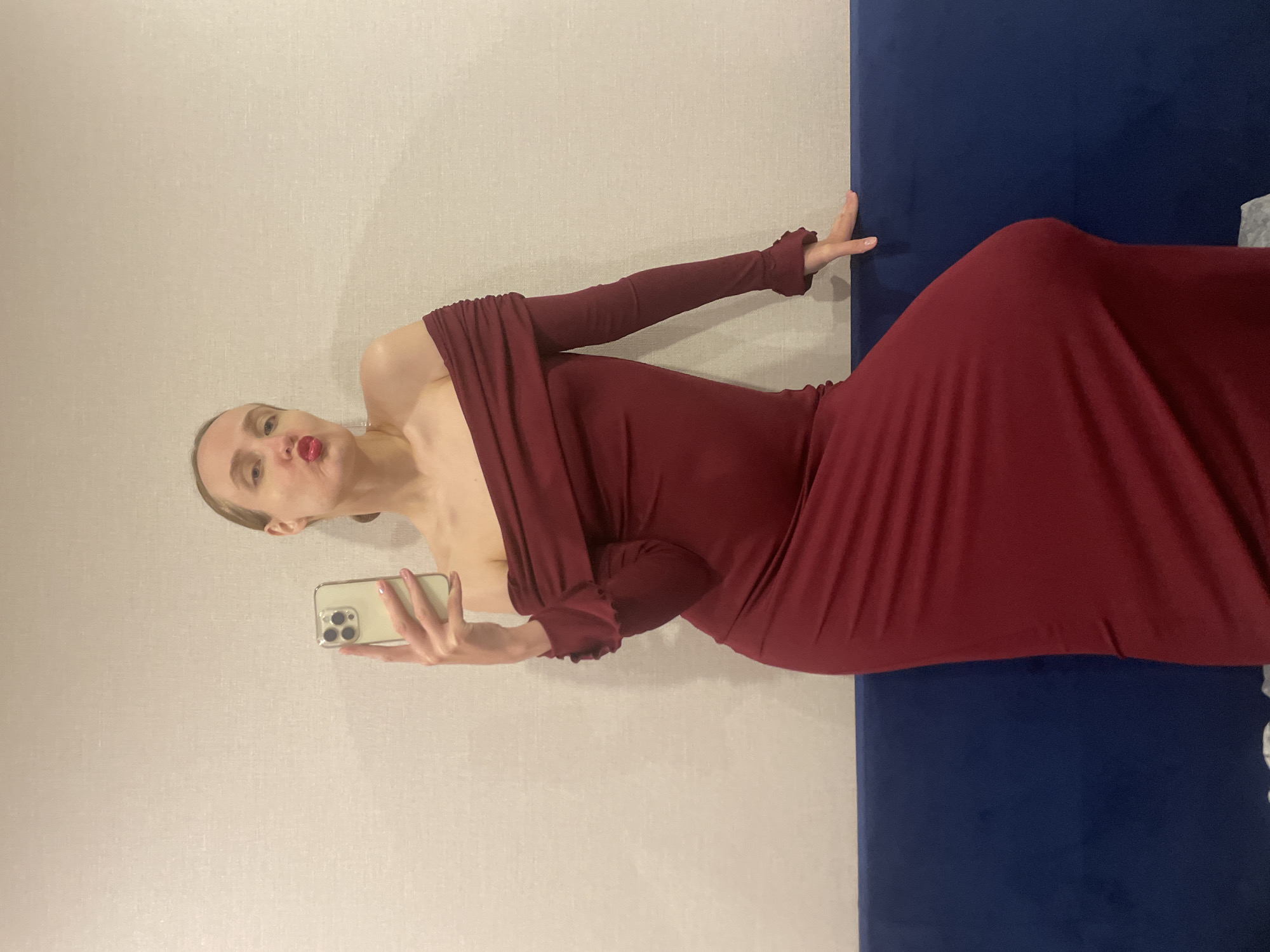 Woman takes selfies in red dress in Russian town