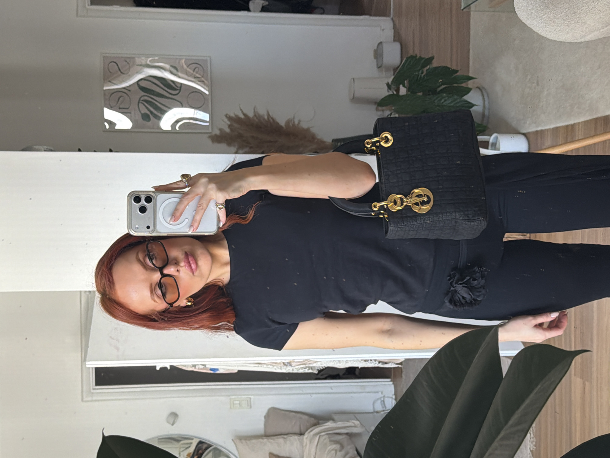 Woman takes mirror selfies in Parisian apartment