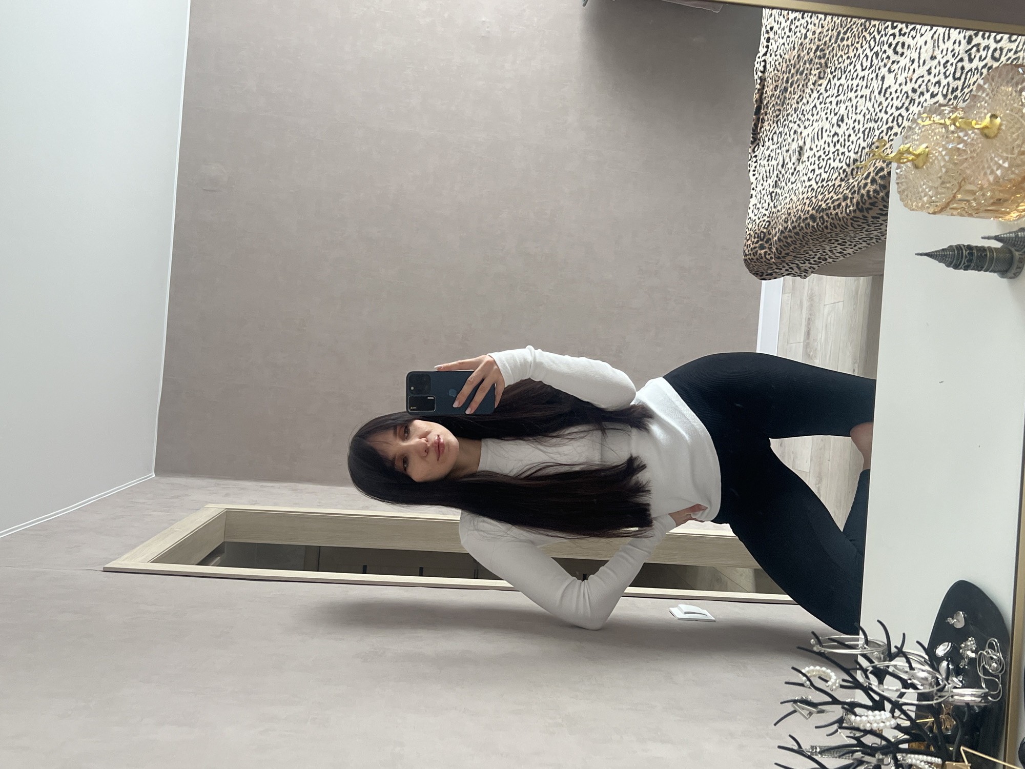 Woman takes mirror selfies in Votkinsk room