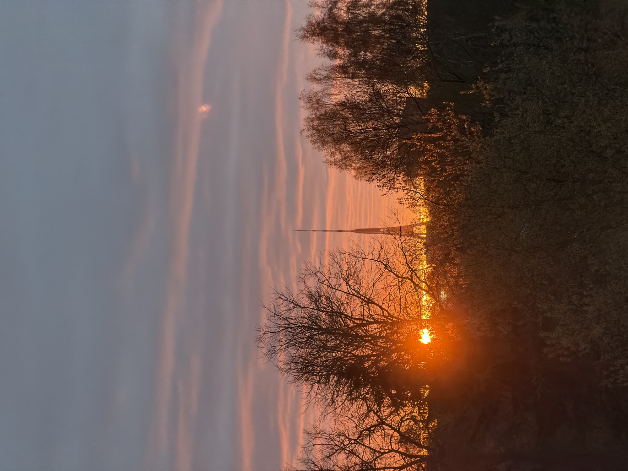 Sunset captured over Riga with radio tower silhouette