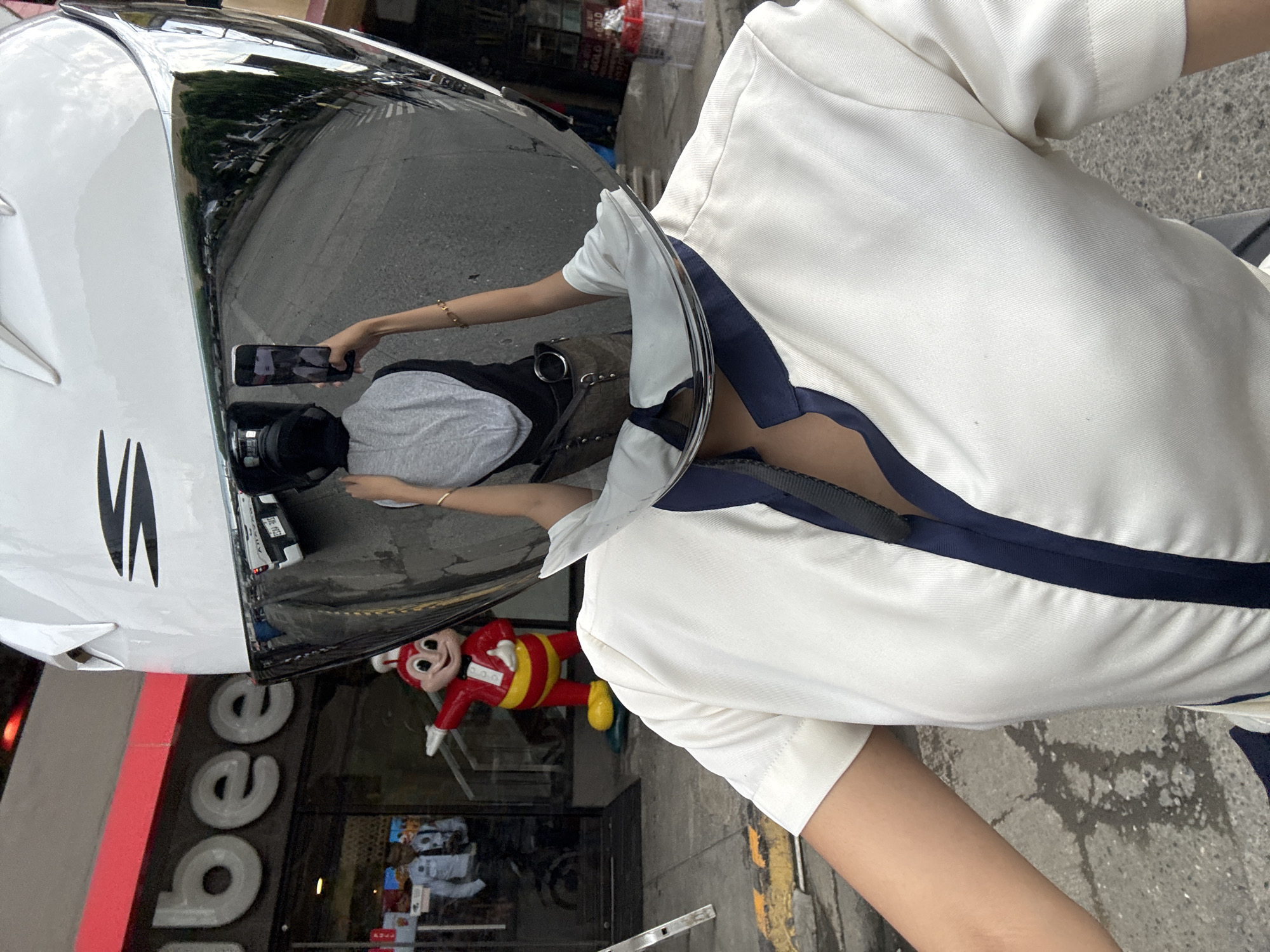 Motorcycle rider in Davao City, Jollibee reflected in visor