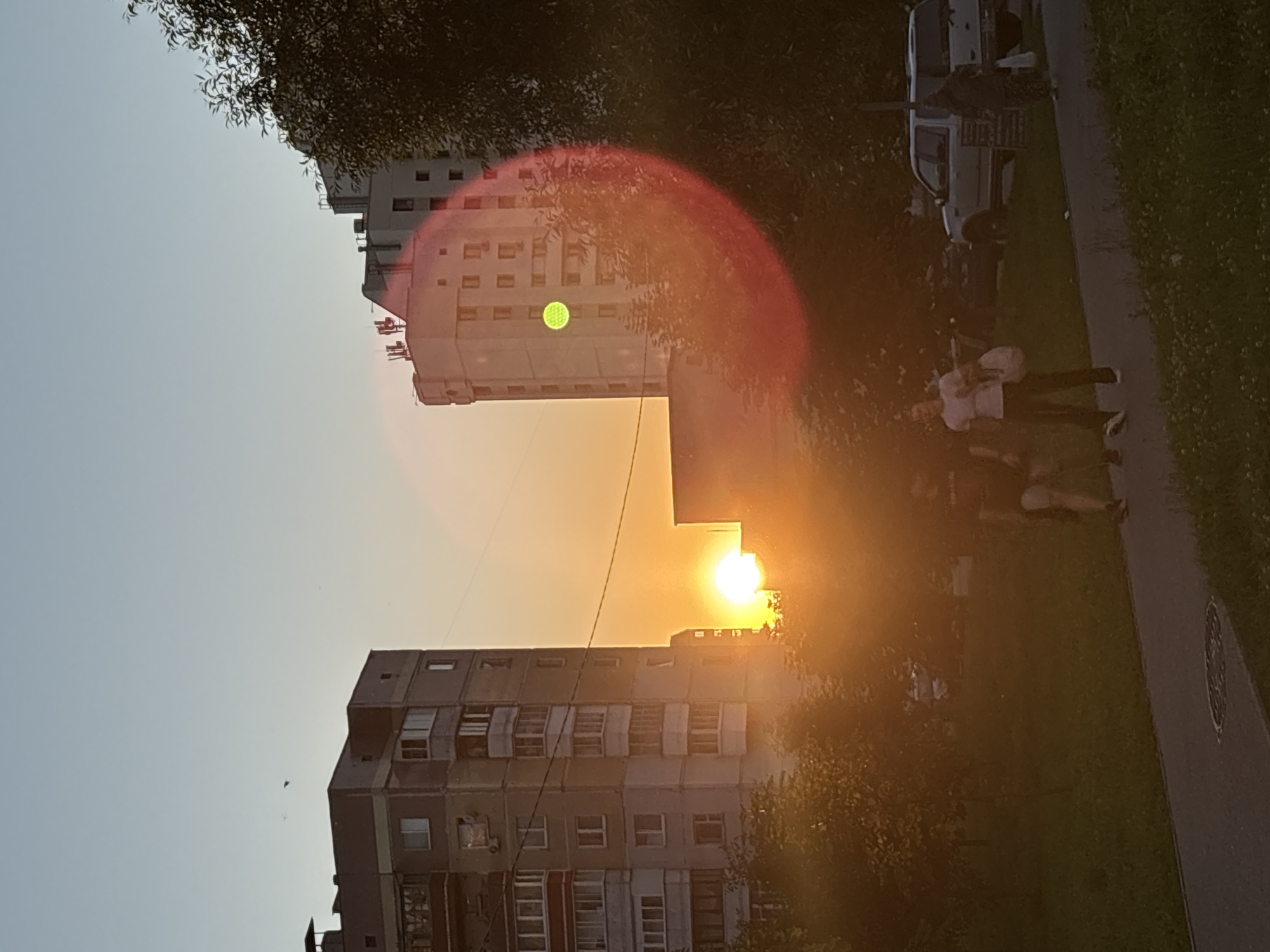 Sunset over a Vitebsk apartment complex, July 2026