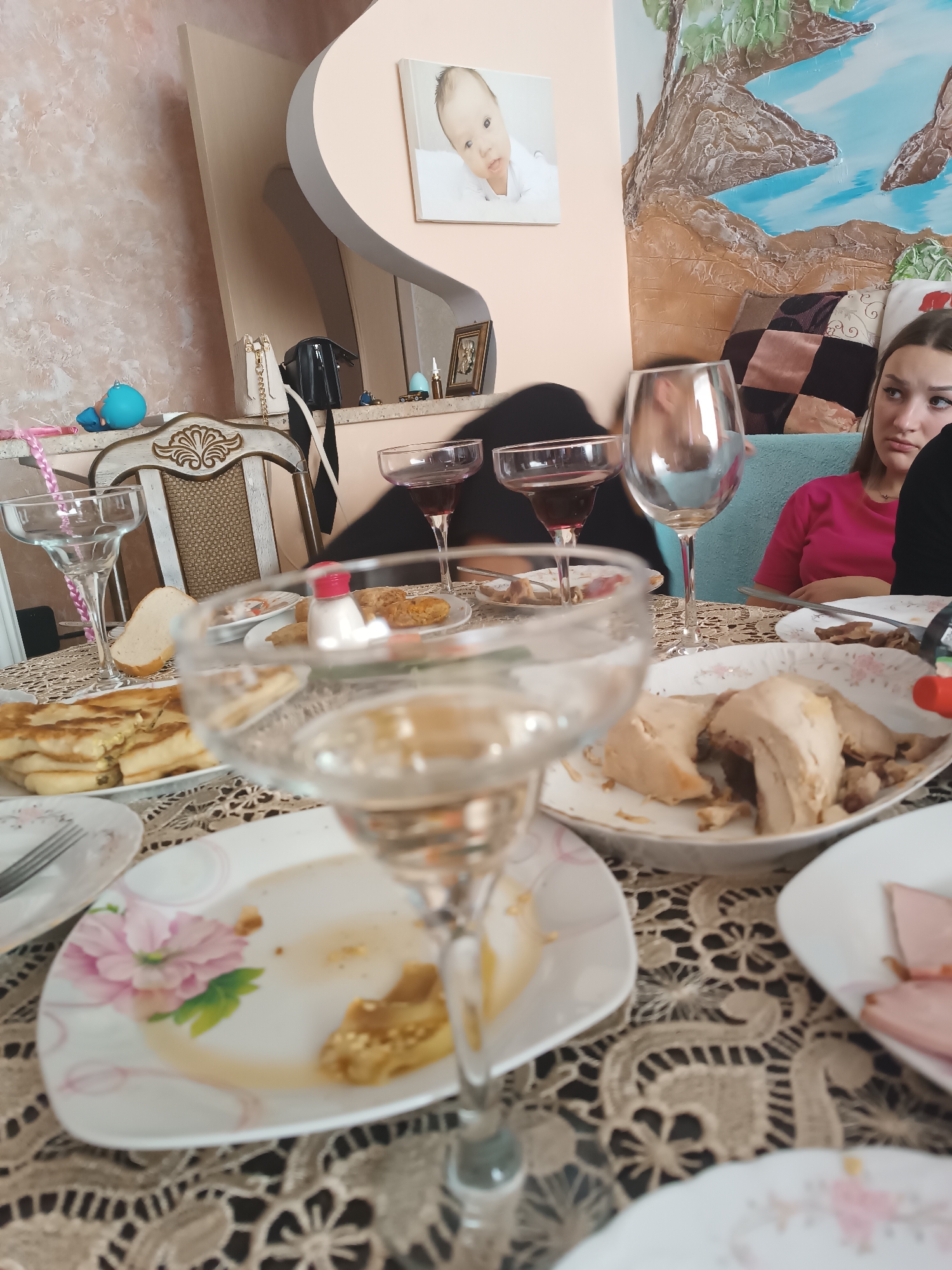 Casual home gathering over food and wine in Durlești
