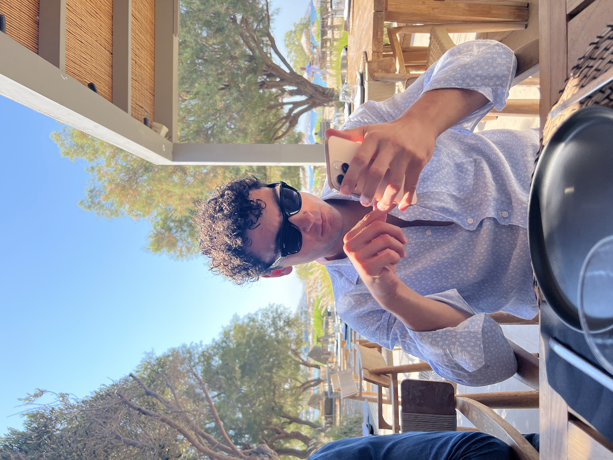 Lazy summer afternoon at a beachside café in Naousa