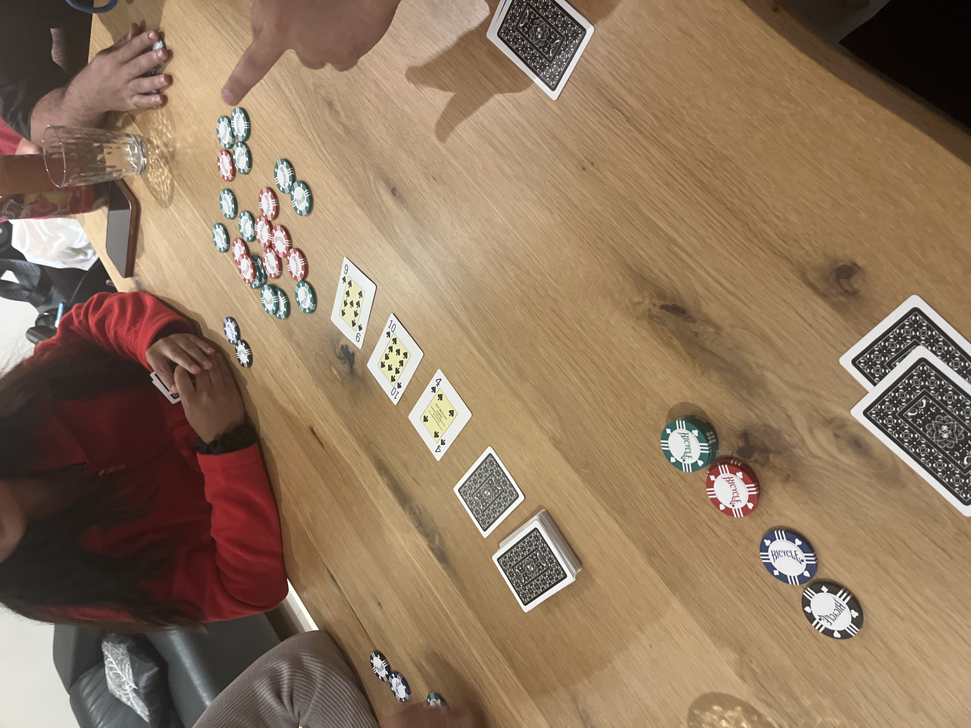 Card game with poker chips observed in Benitachell, Spain