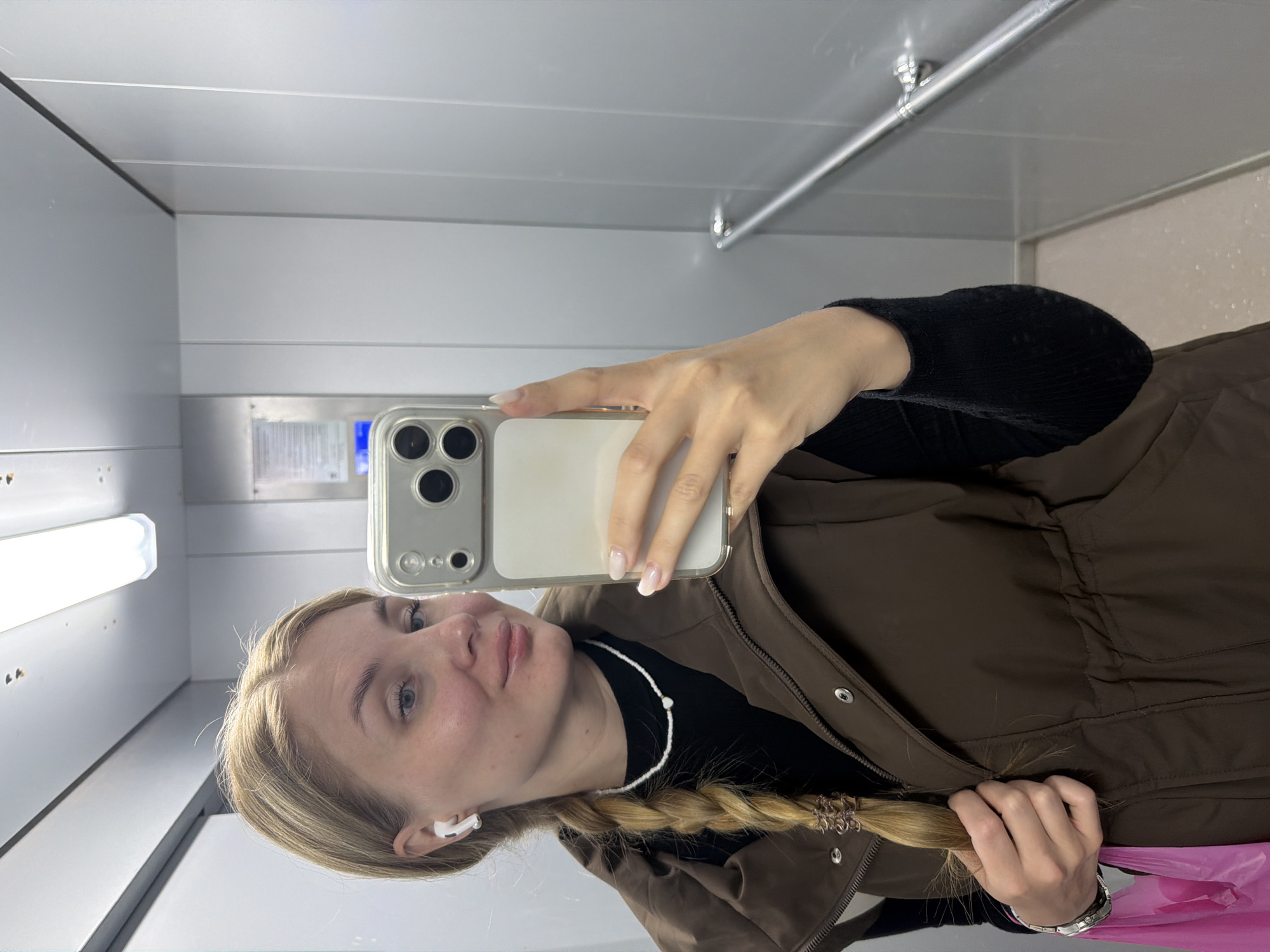Woman takes selfie in elevator in Chaikovsky, Russia