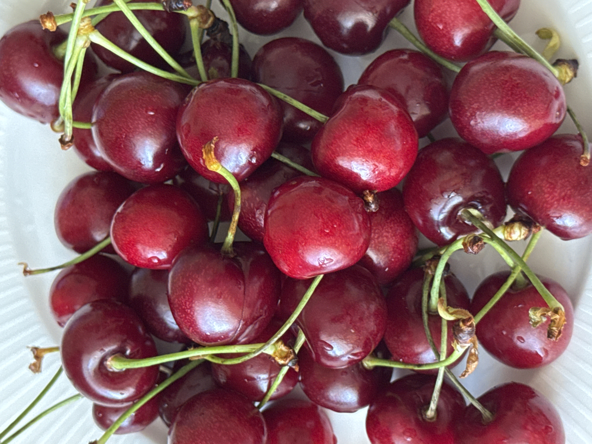 Fresh cherries and wall paintings captured in Saint Petersburg