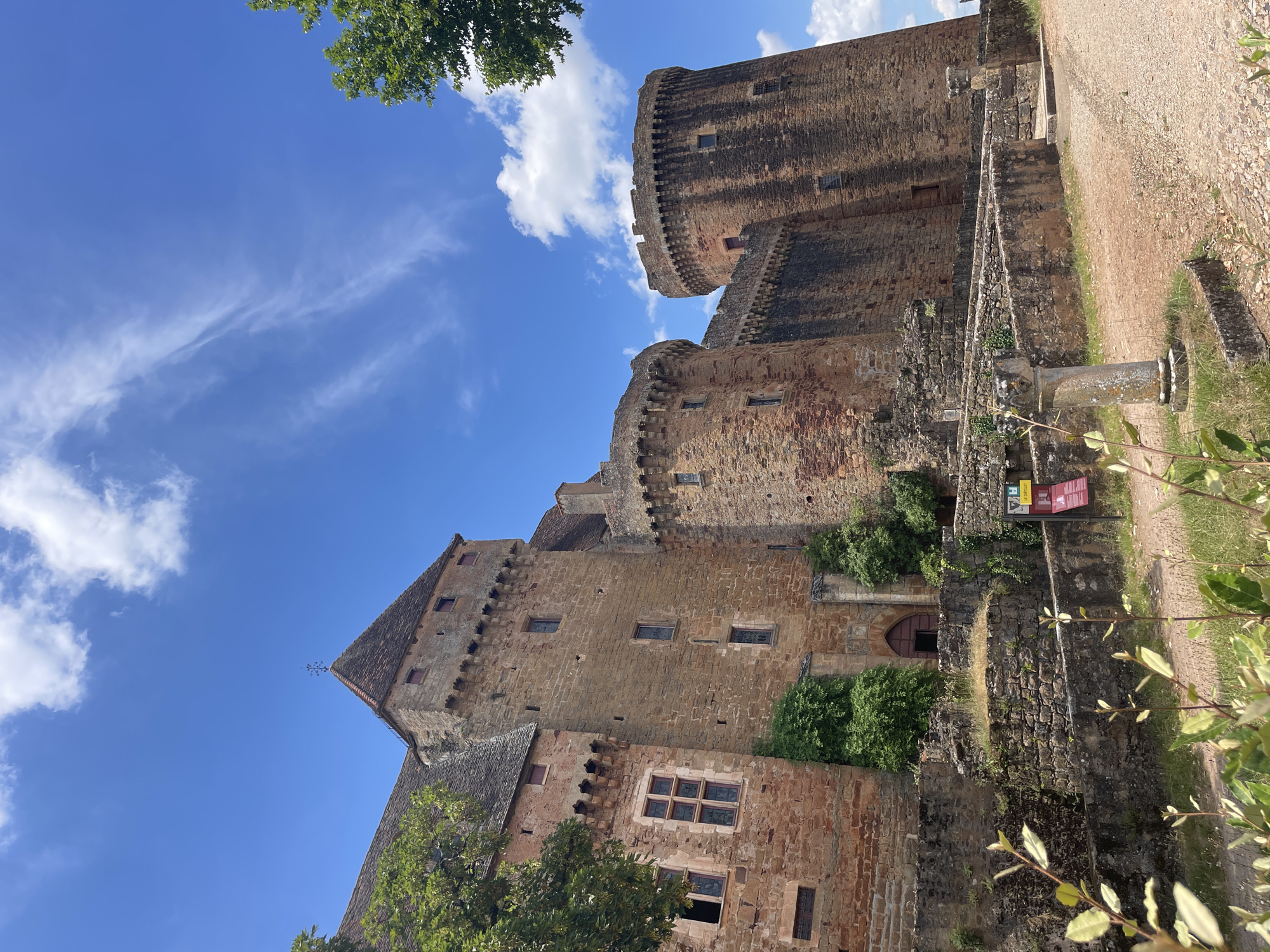 Medieval castle and rural hillside on a sunny afternoon